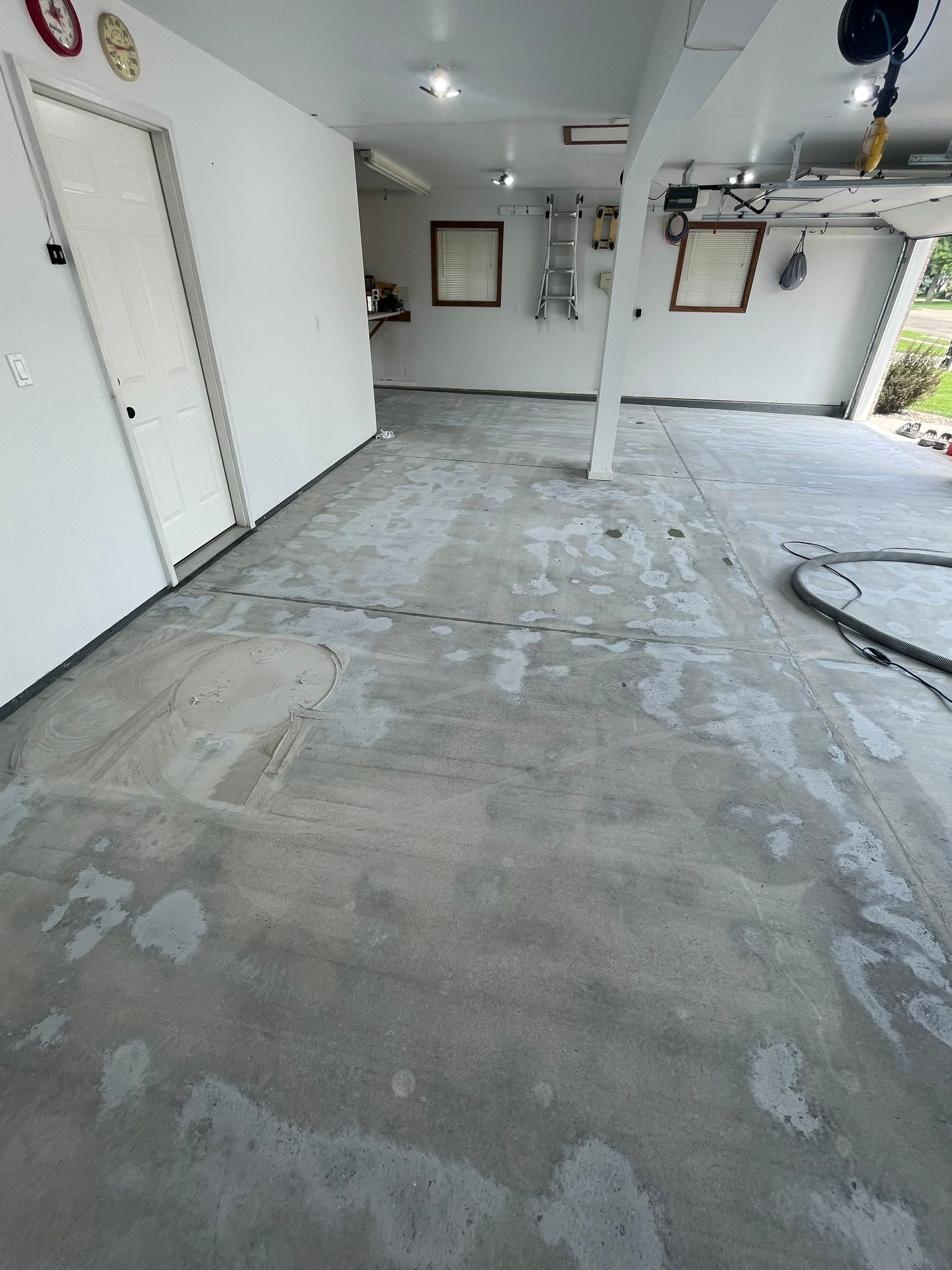 Multi-Car Garage Concrete Coating with Coyote Flake Finish in Sioux Falls by Select Painting, Coatings & Garage Cabinets