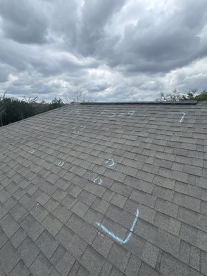 Wide view of architectural asphalt shingle roof with markings