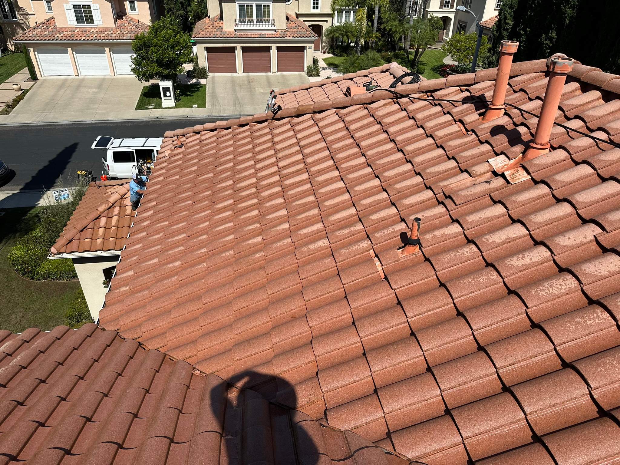 Roof wash on this dirty roof covered in algae by Property Cleaning Experts, LLC