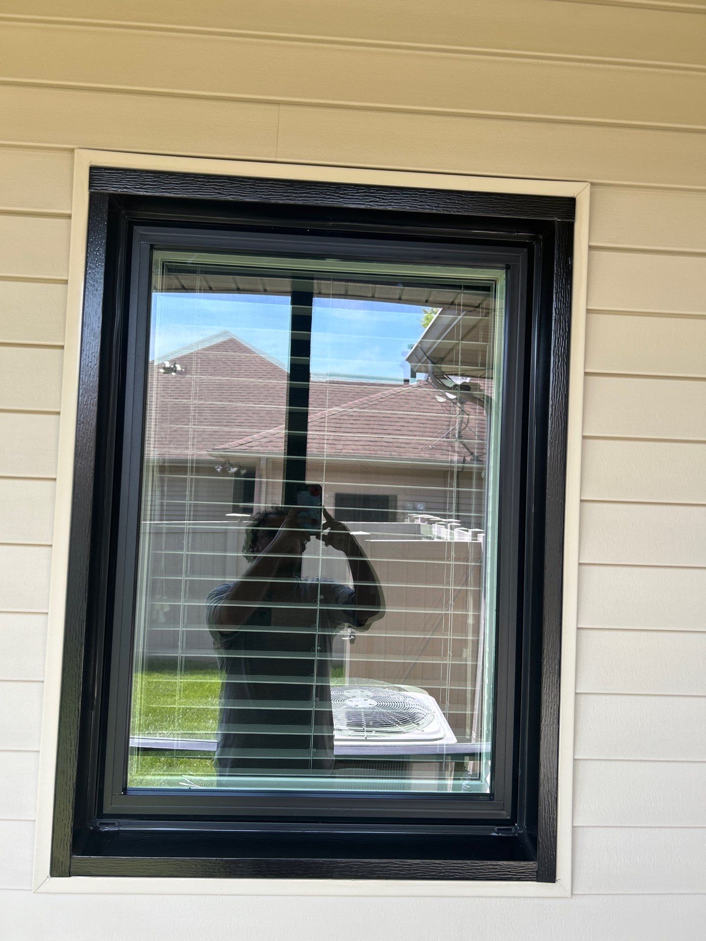 Black Vinyl Window Installation by Merrifield Exteriors, LLC