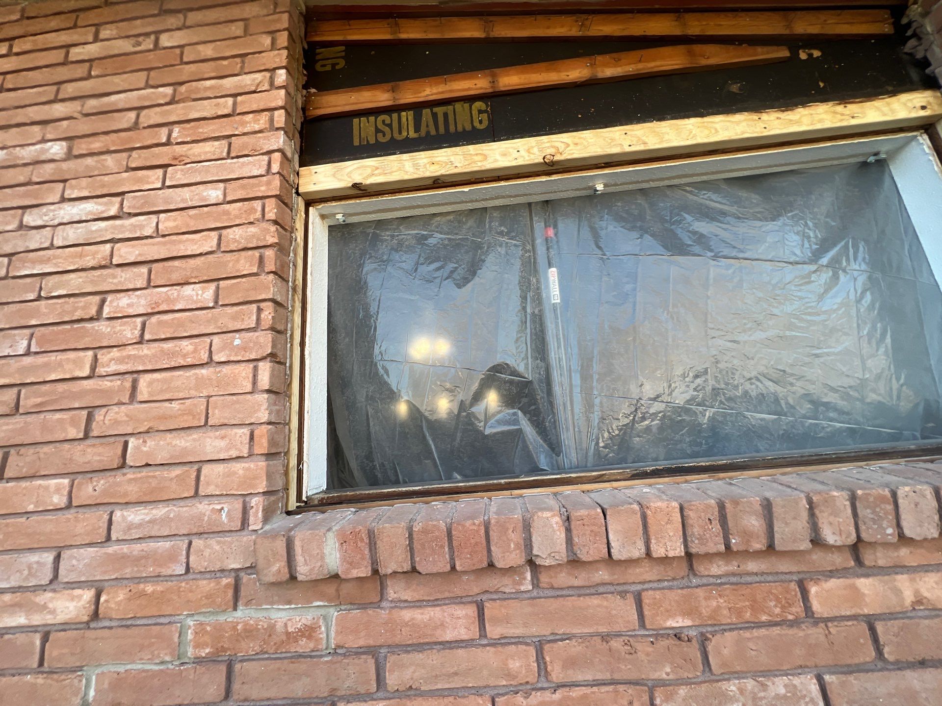 Windows in Brick with a Bay Window by Bayfront Roofing and Construction