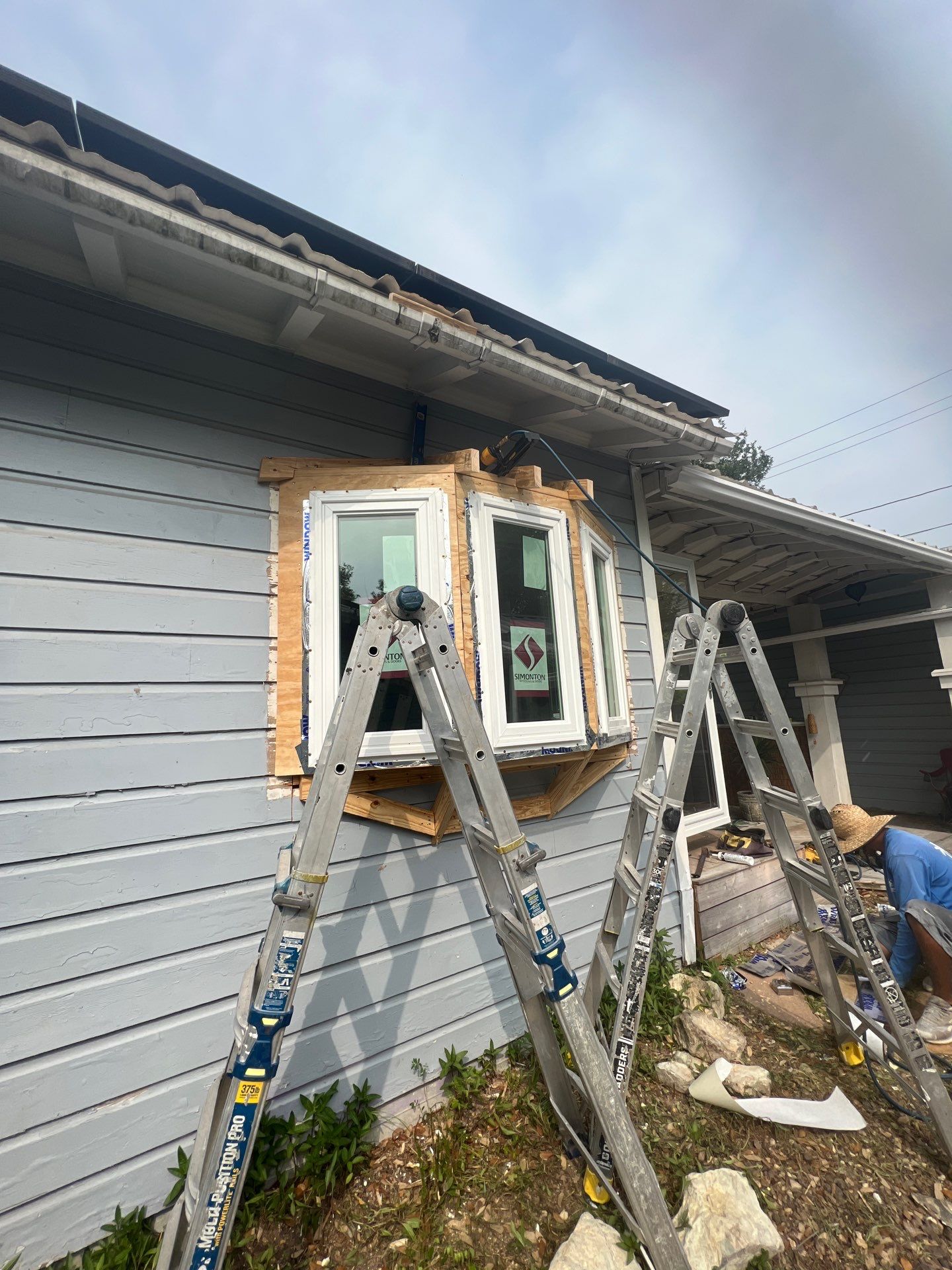Installing Windows on a Submarine  by Bayfront Roofing and Construction