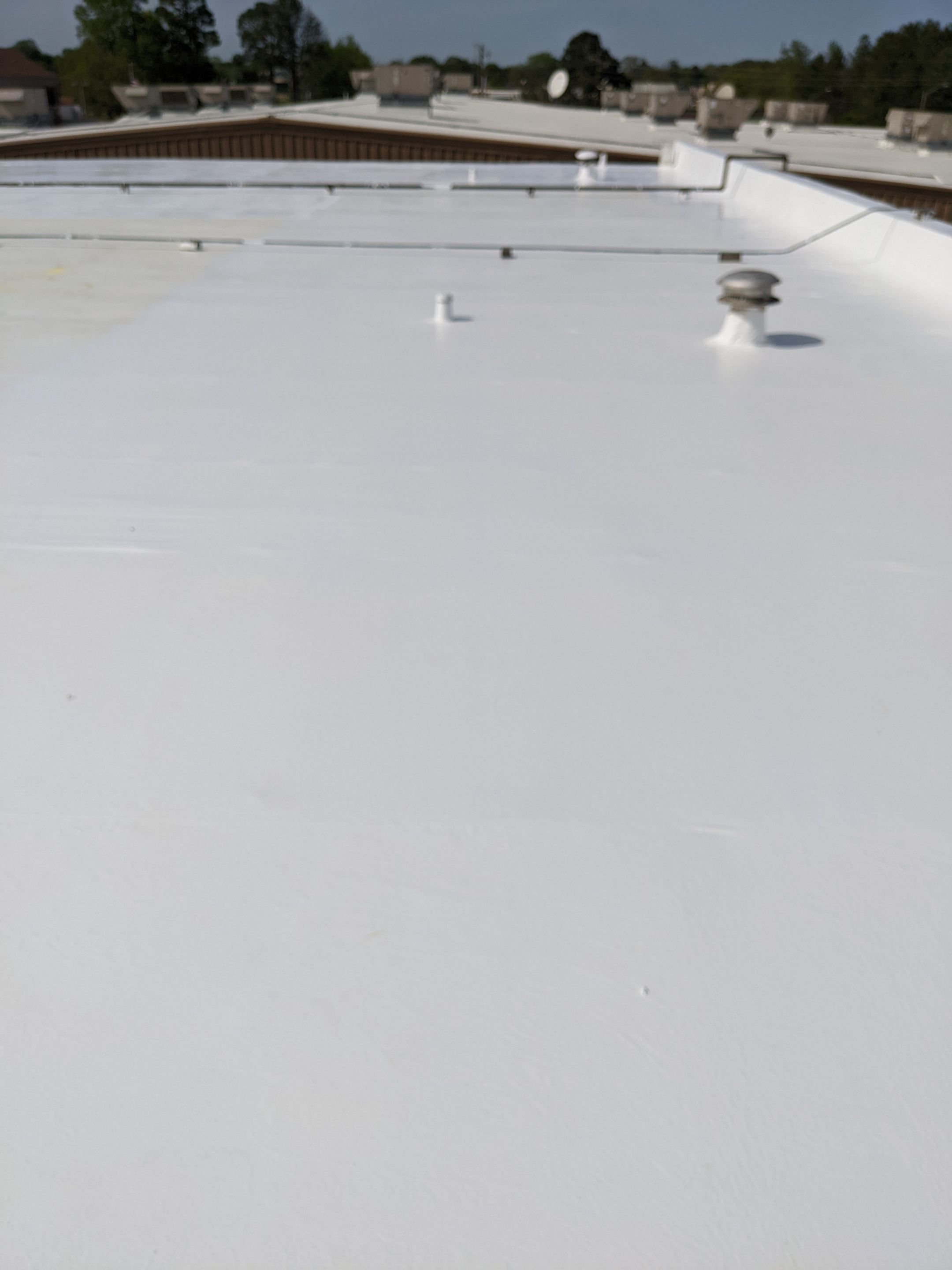 Commercial Roofing Installation using Aldocoat Coatings by Hostetler Roofing