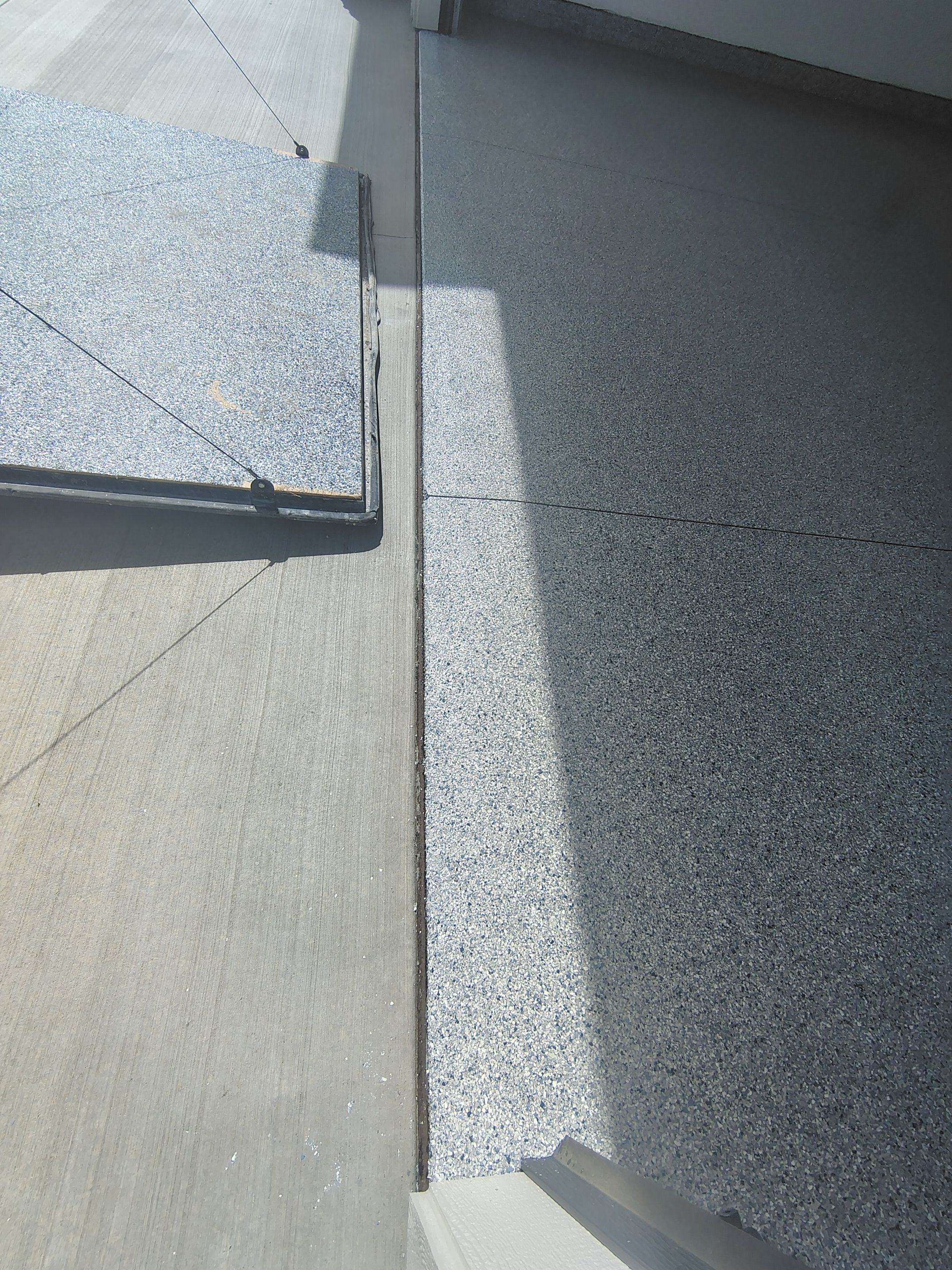 Sioux Falls Garage Floor Transformation with Gray Decorative Flake Coating by Select Painting, Coatings & Garage Cabinets
