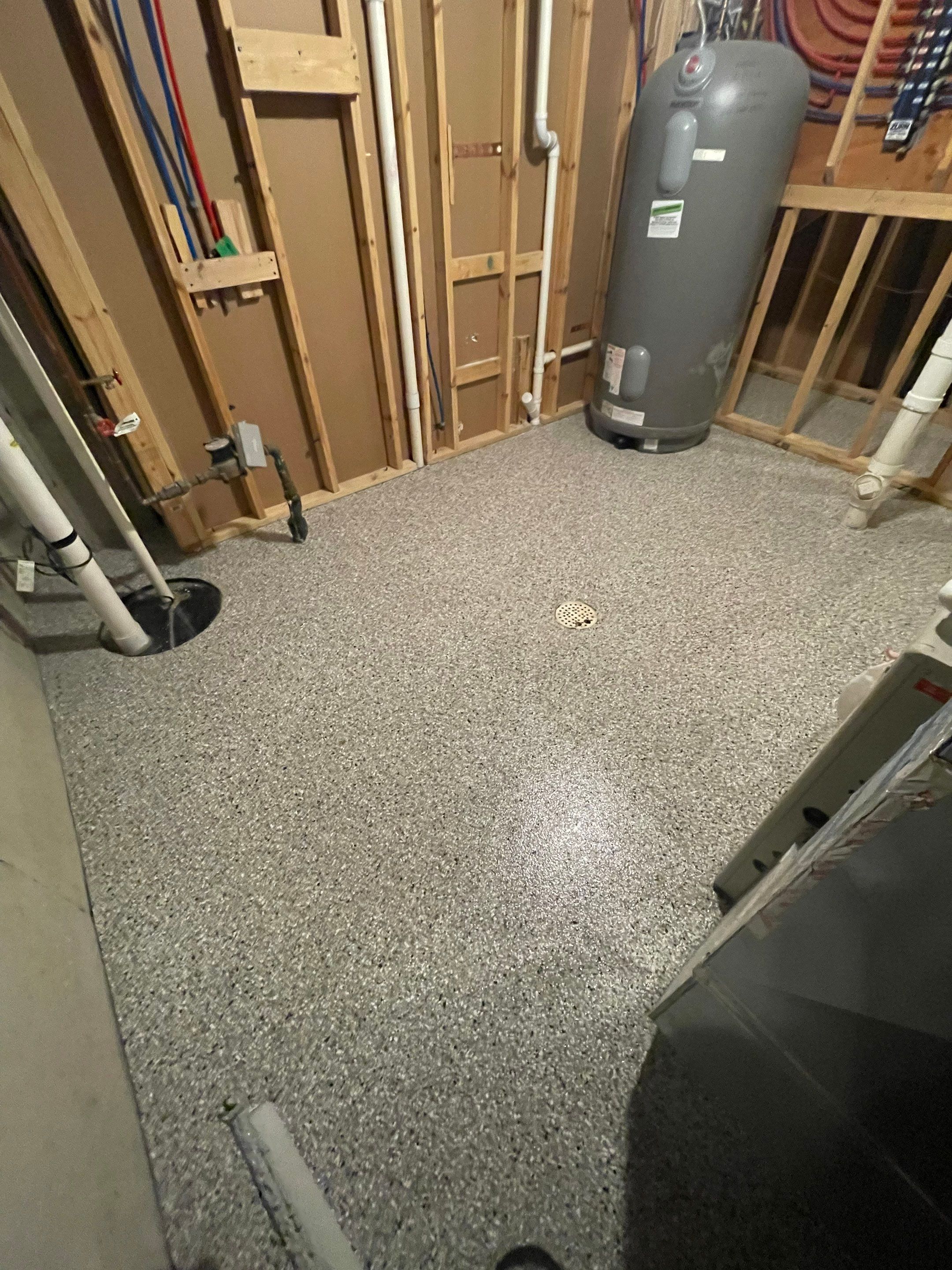 Sioux Falls Basement Floor Transformation with Durable Epoxy Flake Coating by Select Painting, Coatings & Garage Cabinets