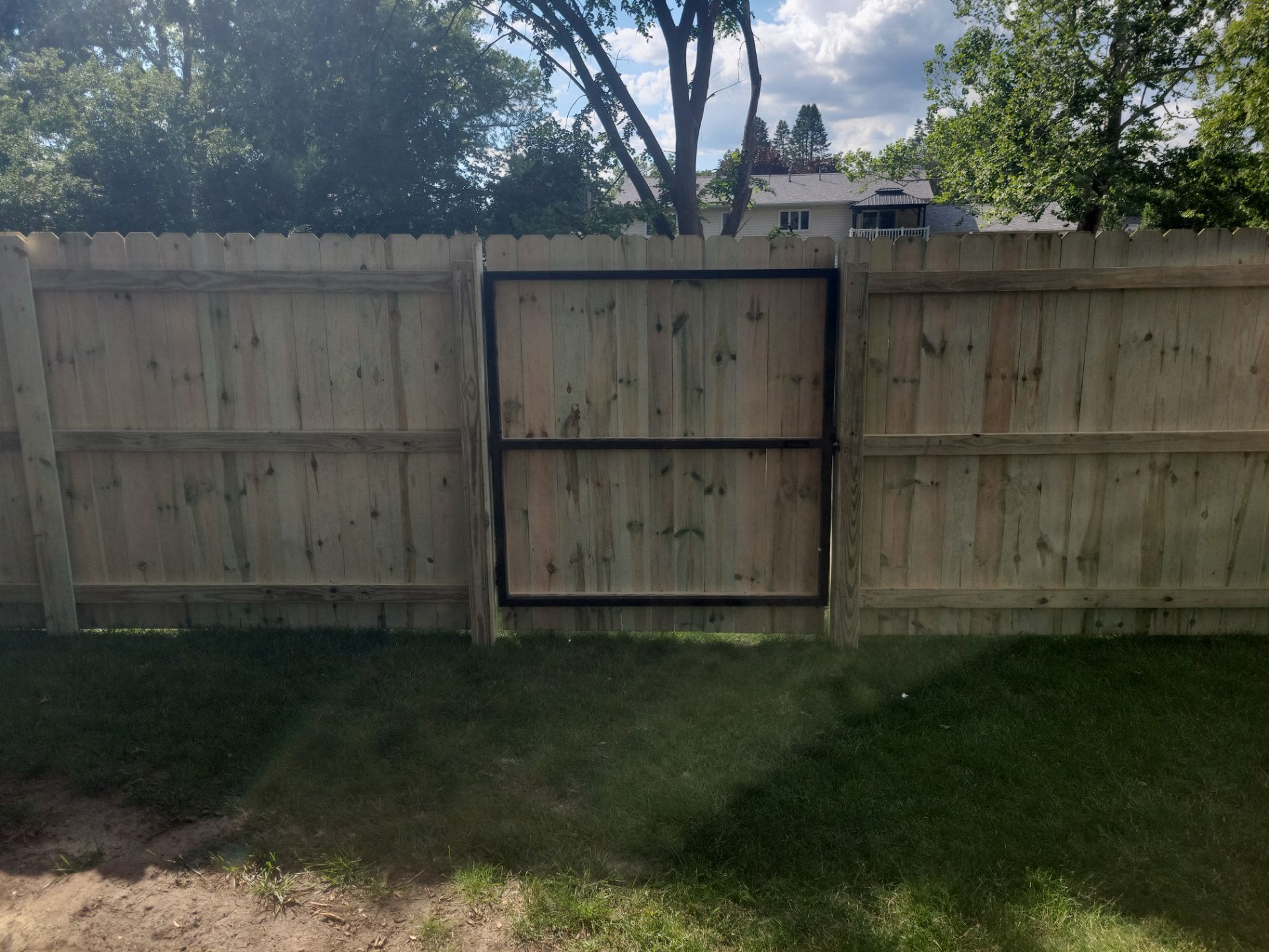 Pressure-Treated Pine Privacy Fence and Custom Gates in Waterloo by Perfect Picket Fence and Stain