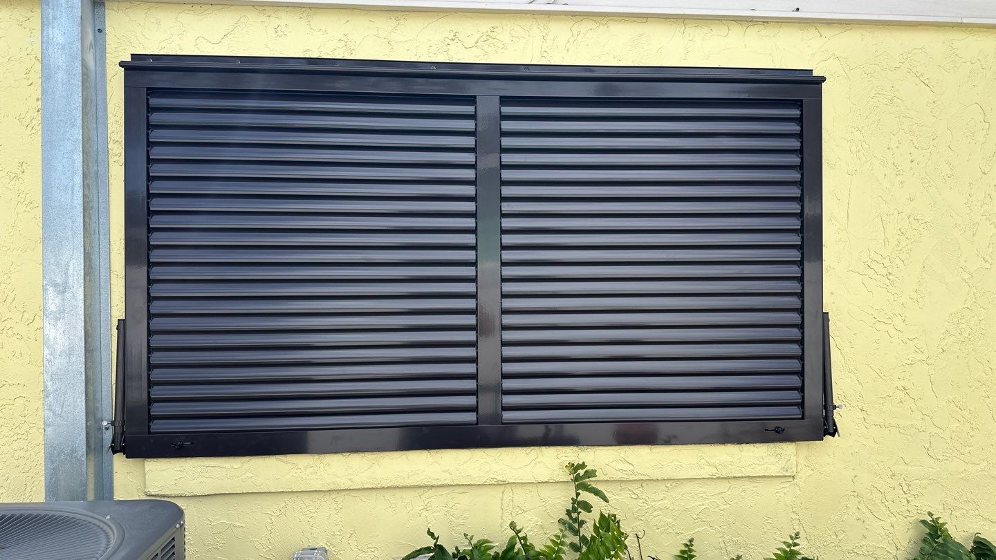 Hurricane Rated Bahama Shutters in Grey Brown by Smart Guard Shutters