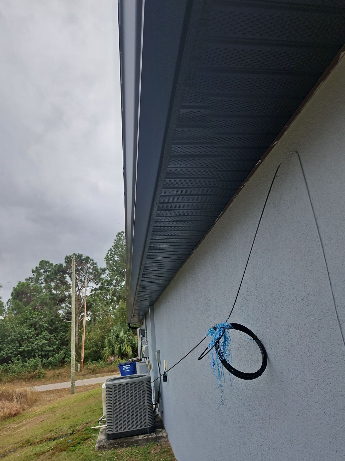 Black Seamless Gutters & Soffit/Fascia in Lehigh Acres FL by Gutter Professors