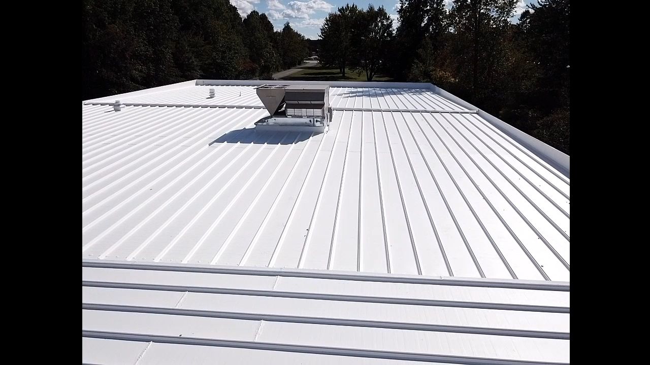 Commercial Metal Roof Coating by Gold Star Roofing LLC