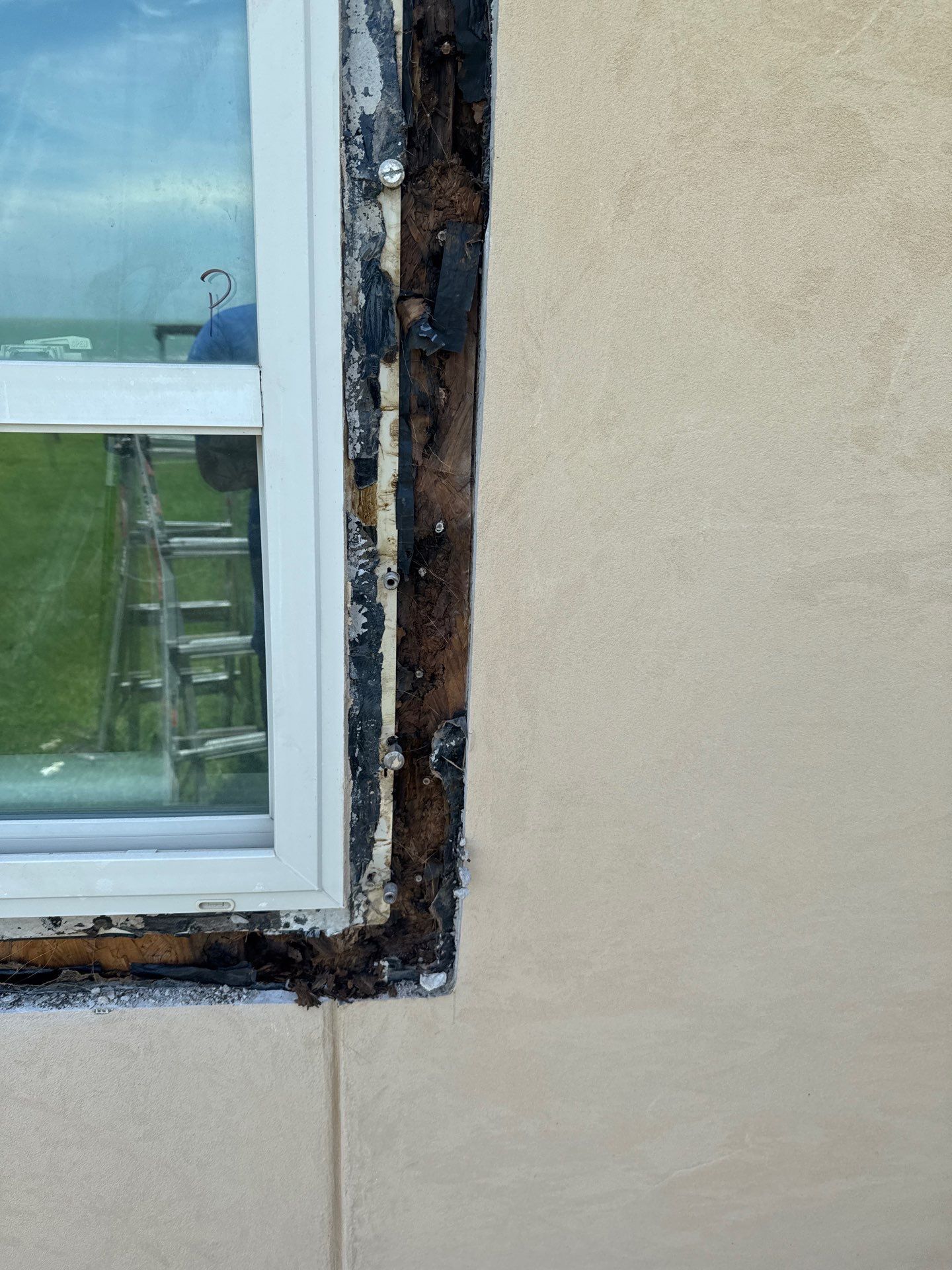 Installing Windows on a Submarine  by Bayfront Roofing and Construction