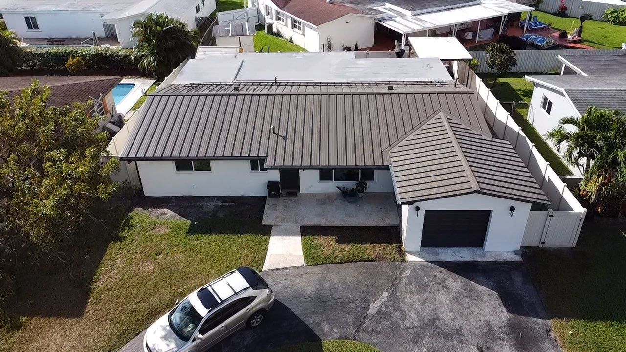 Residential Roofing Installation using Metal Roof  by City Roofing Inc