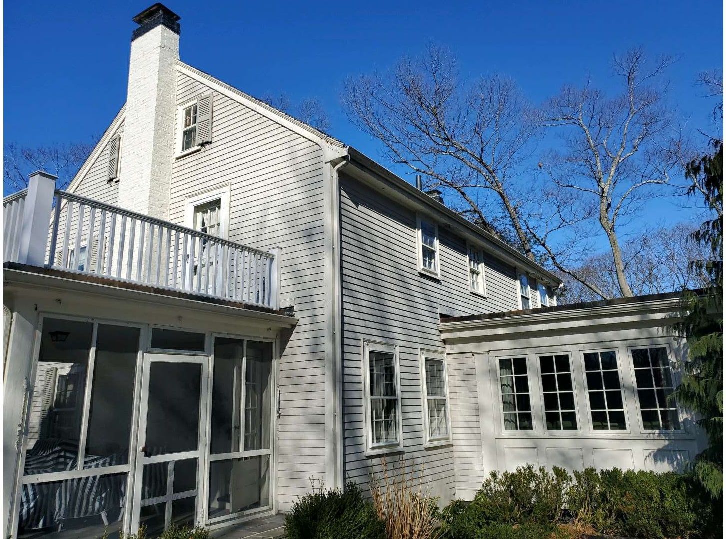 Wood Clapboards and vinyl Slate roof with new Pella windows in Wellesley. by UBrothers Construction