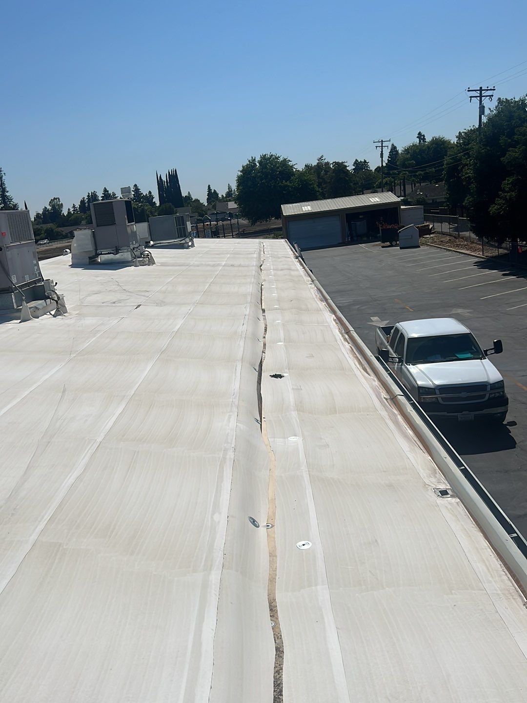 MR Roofing system using Benchmark/PUMA XL coatings over TPO single-ply roofing by Straight Edge Roofing Inc