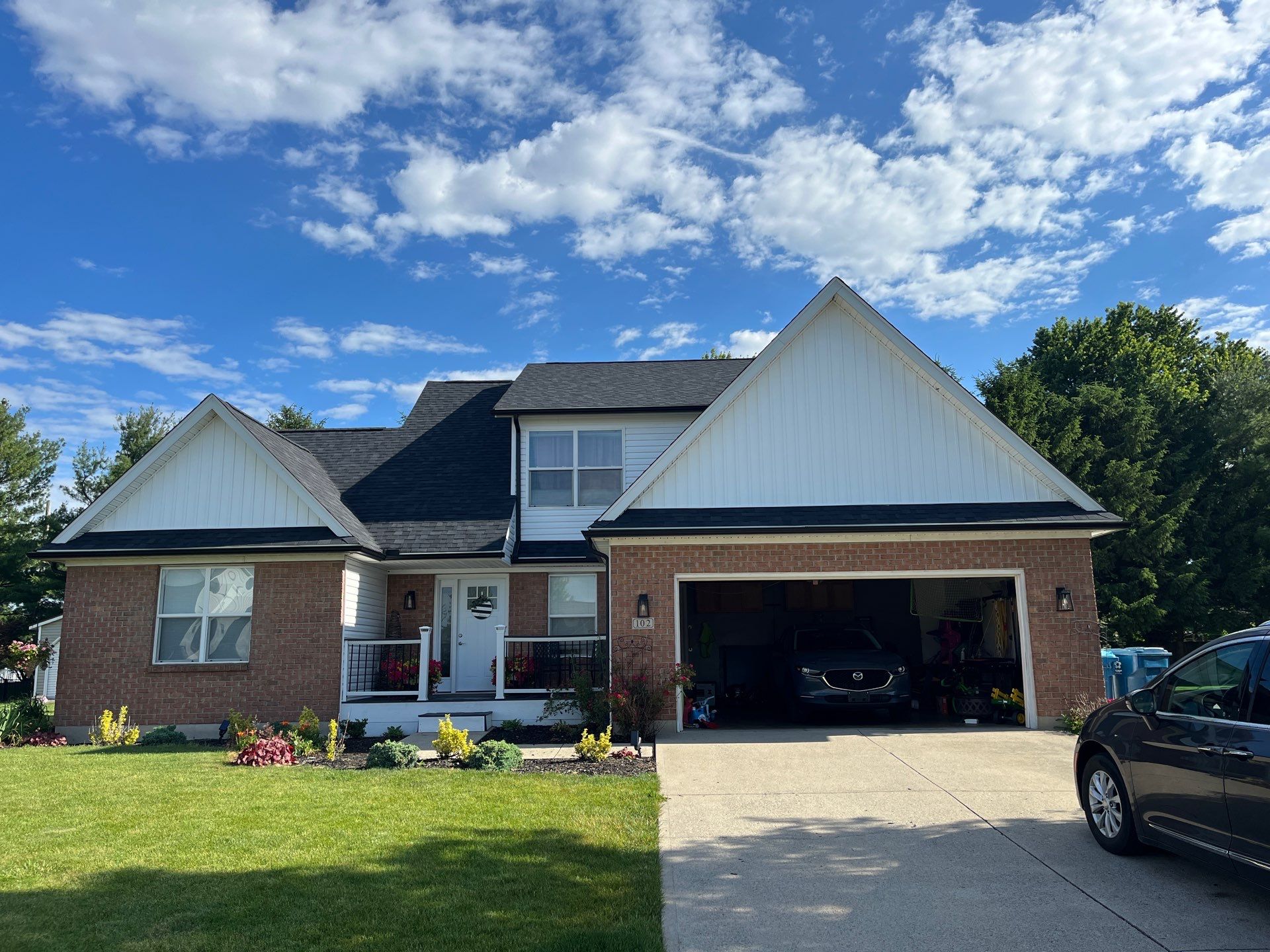 Exterior Installation using Onyx Black Durations and White Siding by WIW Enterprises Inc