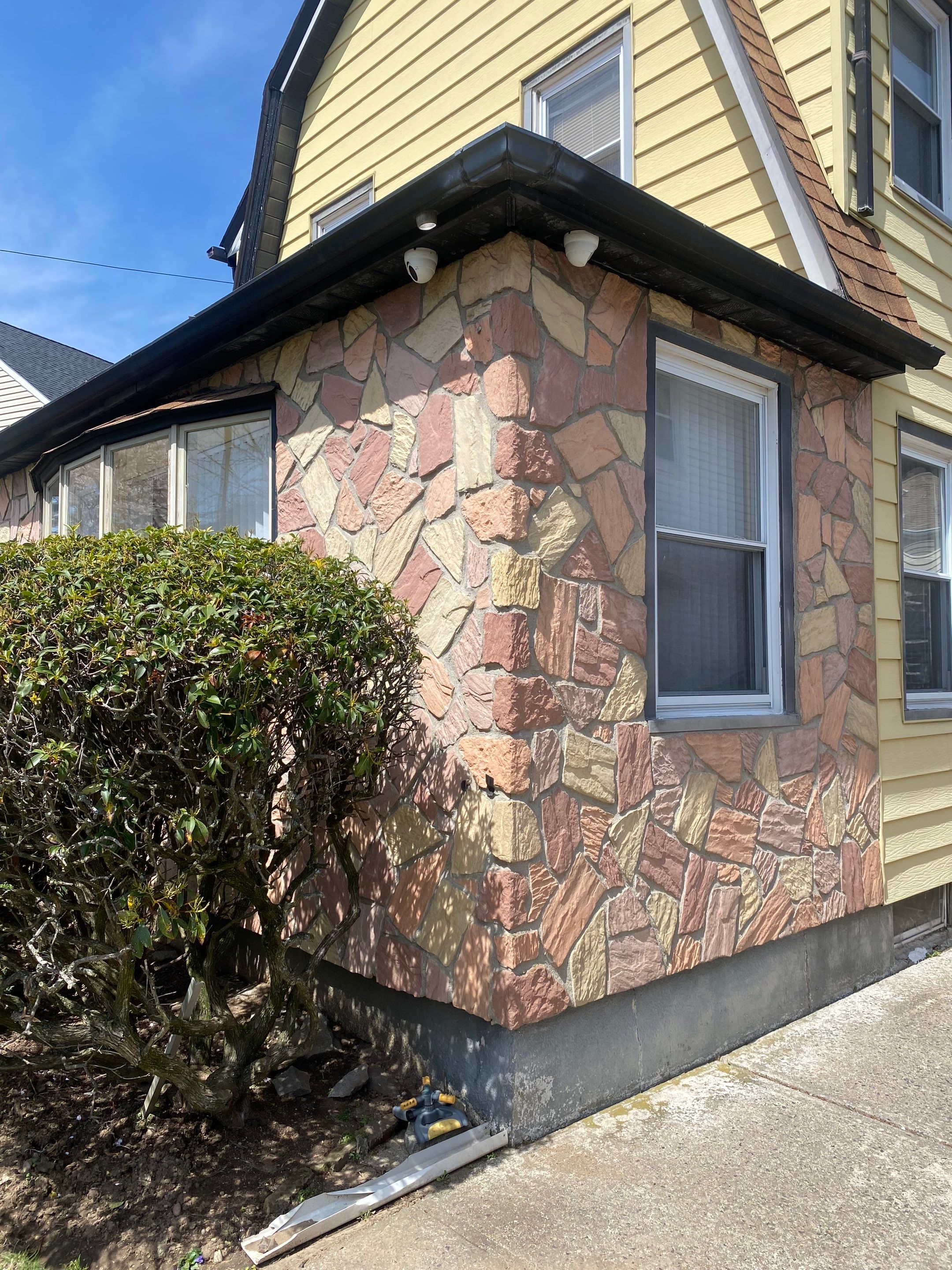 Full House Installation 5" black seamless gutters and 2x3 leaders using 5" black K style seamless gutters and 2x3 black leaders by Above All Gutters