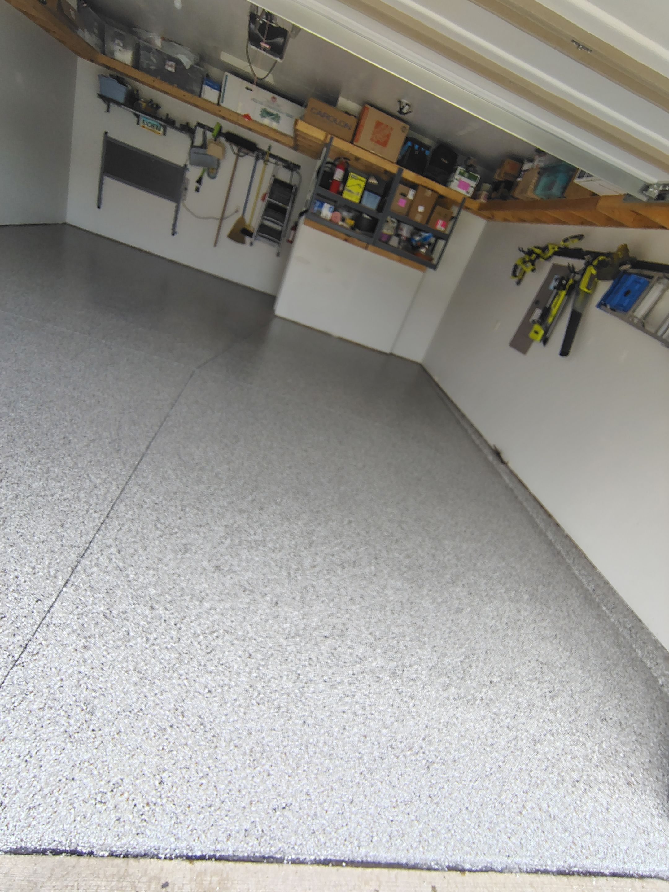 Decorative Chip Garage Concrete Coating Installation in Sioux Falls by Select Painting, Coatings & Garage Cabinets