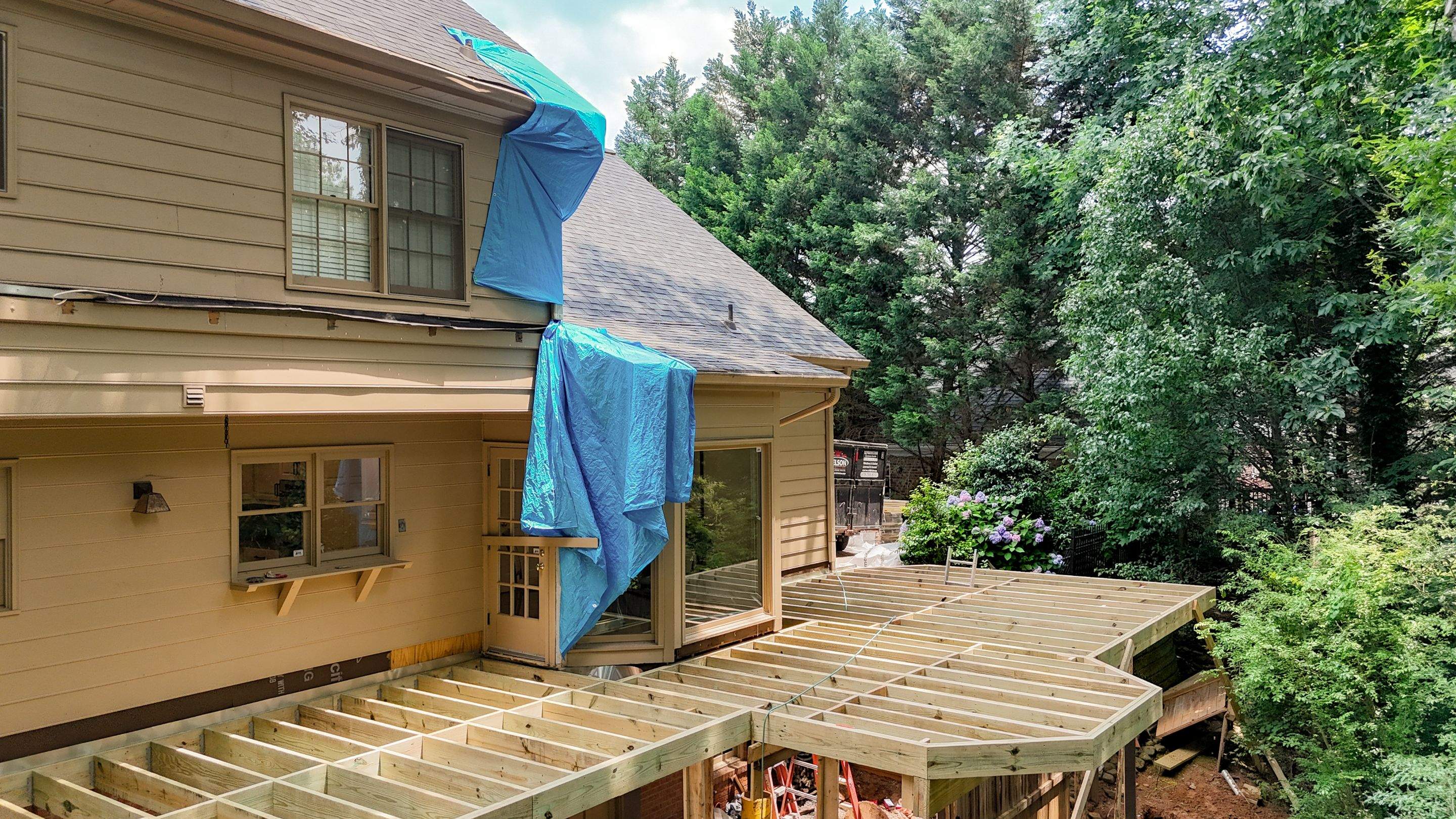 Deckorators Voyage Deck and Shed Style Covered Porch Build with Drink Rail by Nelson Exteriors 