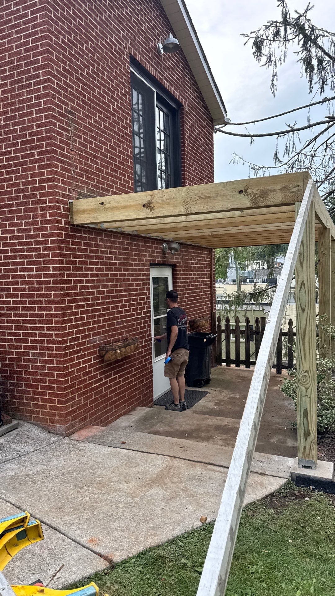 Elevated Composite Deck Rebuild with Black Metal Railing in Lewisburg by Walnut Hollow Decks & Outdoor Living