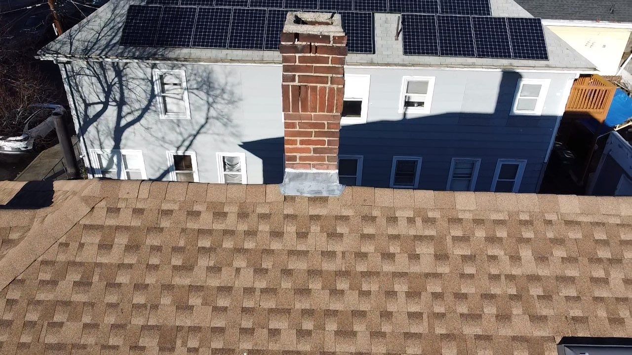 Roof Installation Roof Type: Hip Roof  Multi Family Home- 2 Story by Delarosa Construction & Design