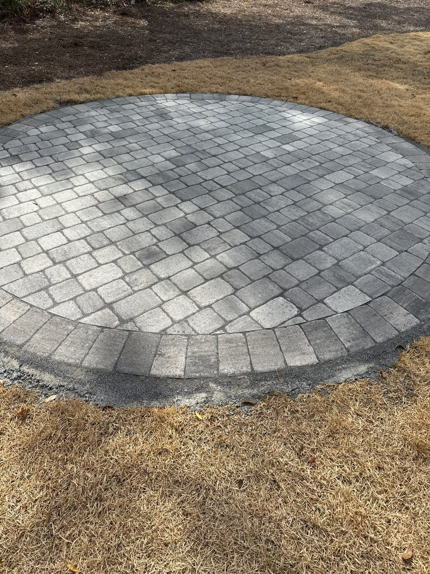 Stamped Concrete Patio and Circular Paver Installation in Hilton Head Island by Lowcountry Scapes, LLC