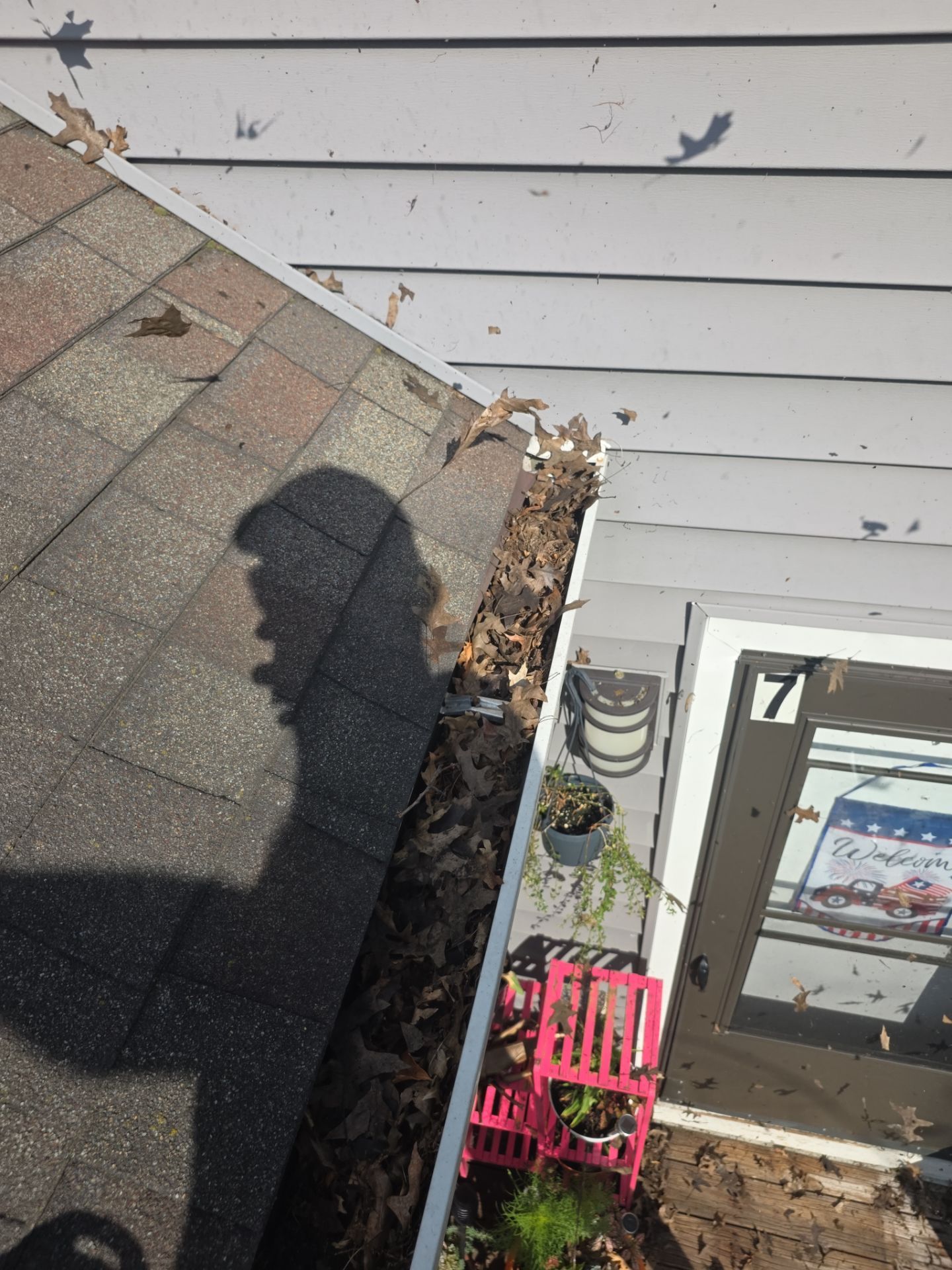 Commercial gutter cleaning Saginaw & Bay City, MI before photo with filled gutters