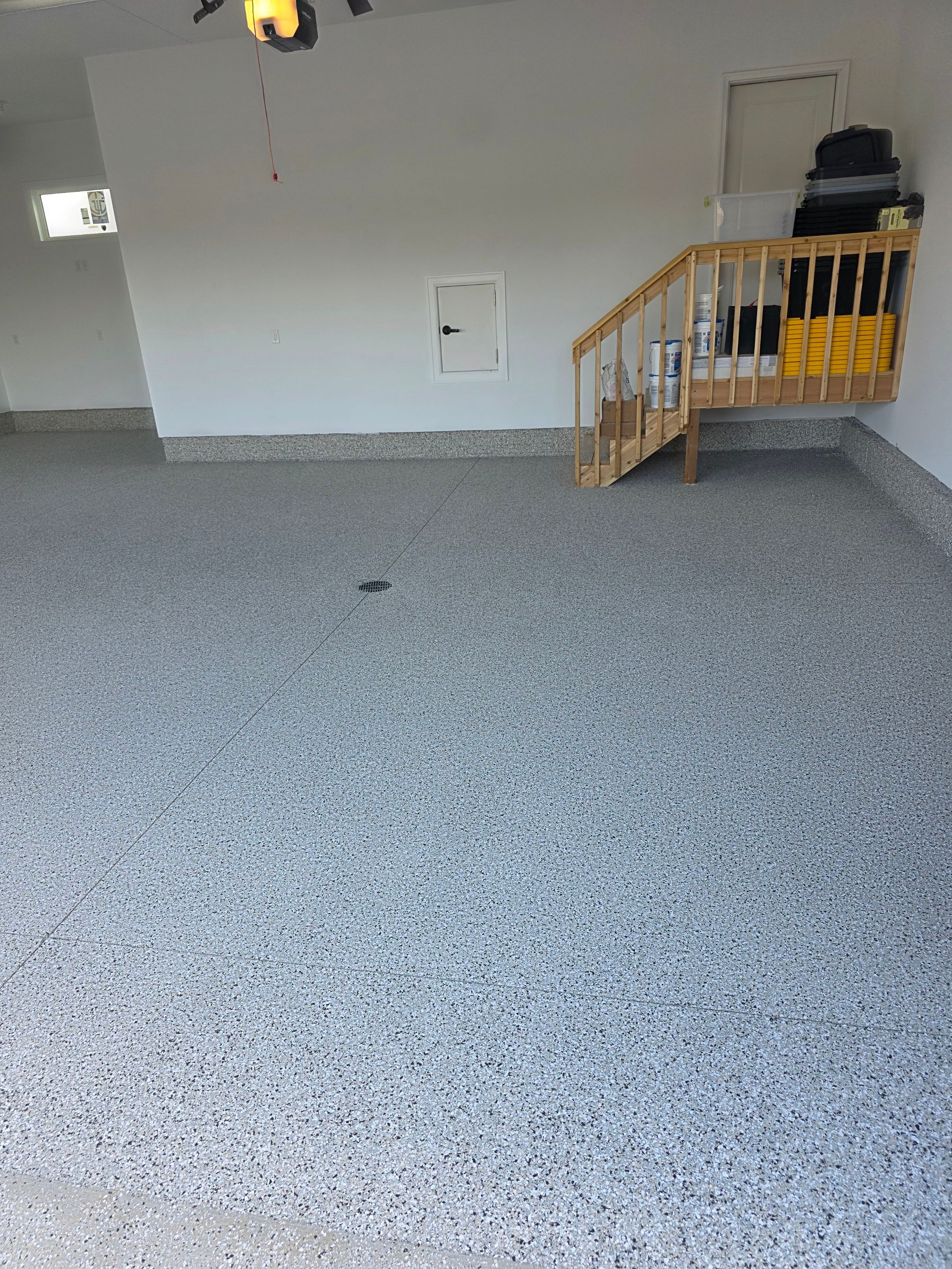 Gray and Black Speckled Polyurea Garage Floor in Dell Rapids by Select Painting, Coatings & Garage Cabinets