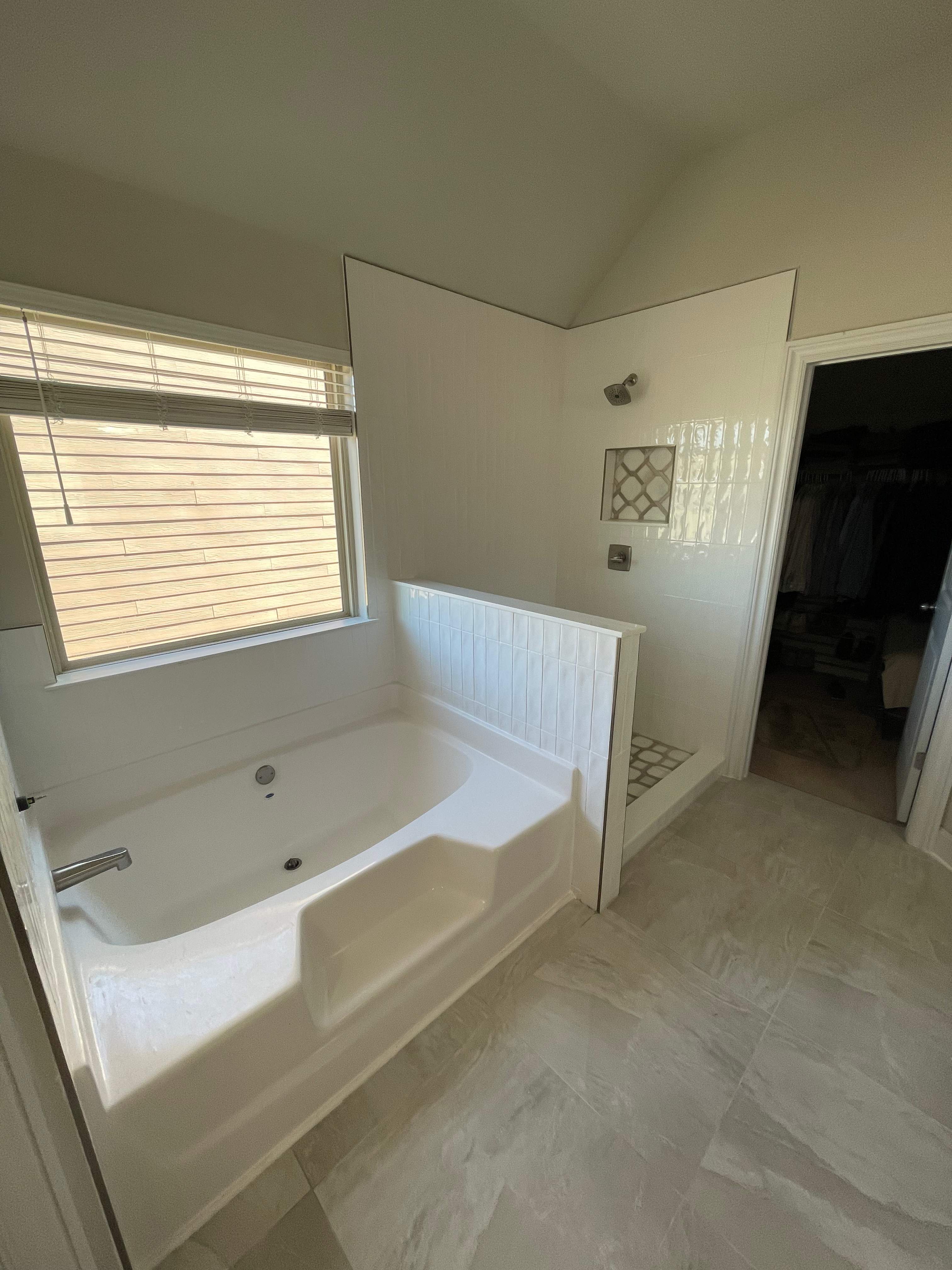 Shower retile and bathroom flooring by Prudencio