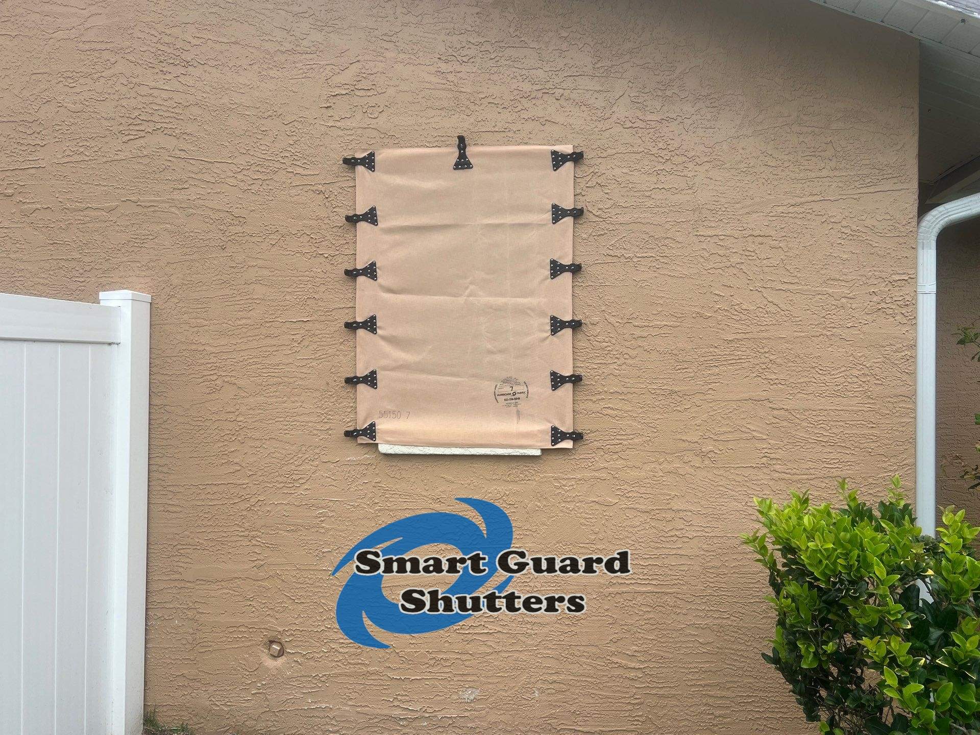 AstroGuard Hurricane Fabric in Tan by Smart Guard Shutters