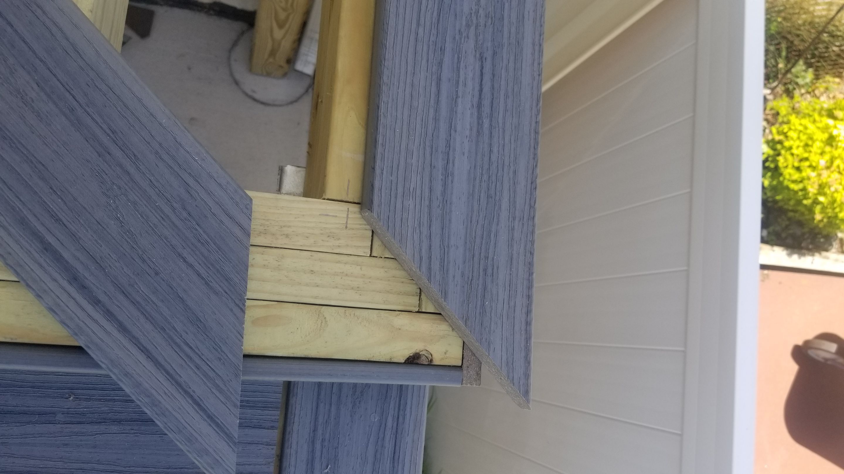 Rebuild balcony flat roofing TREX decking stairway and Railings in Wyandotte, MI by Northwest Construction 