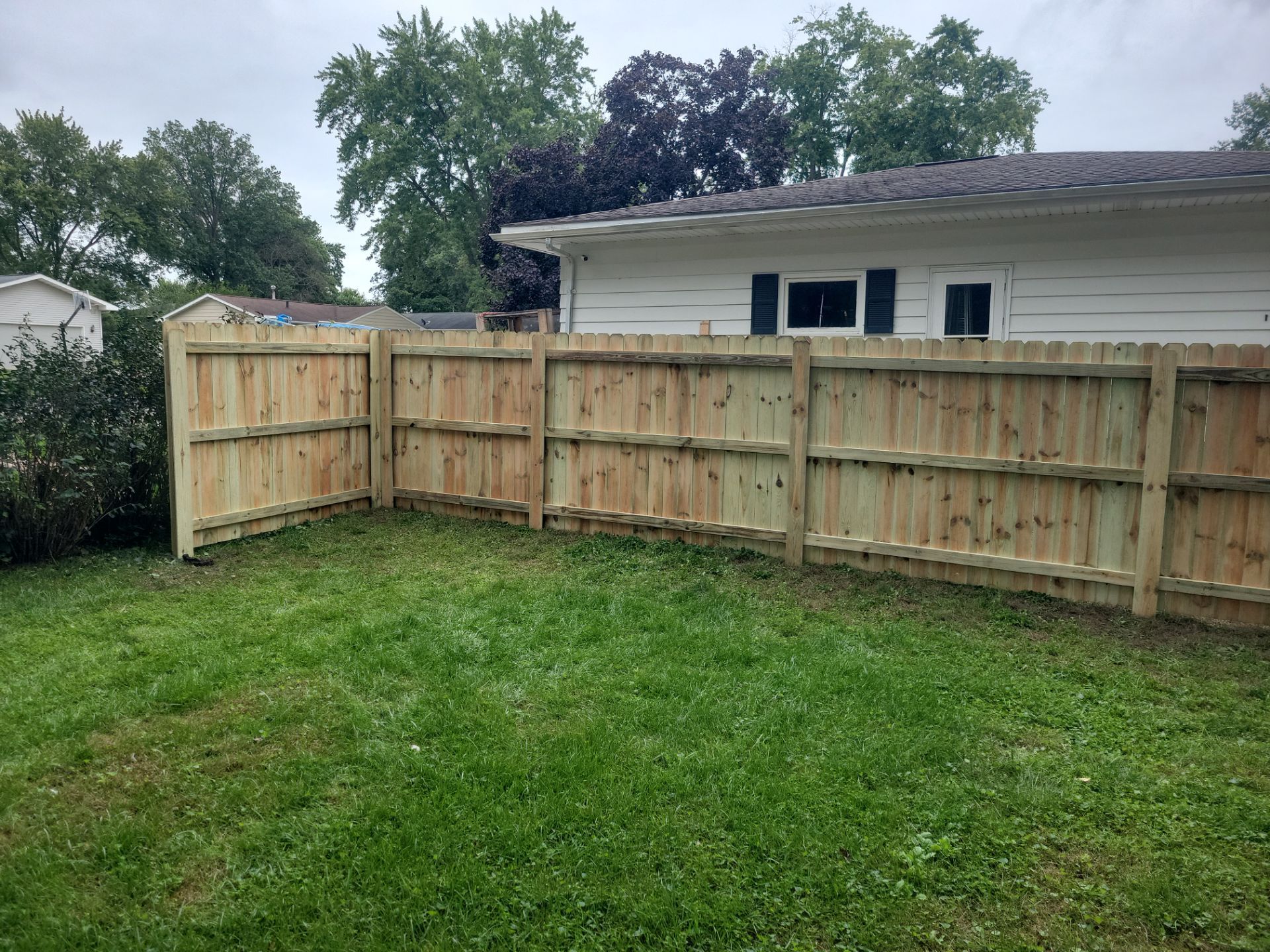 Pressure-Treated Wood Privacy Fence Installation in Waverly by Perfect Picket Fence and Stain