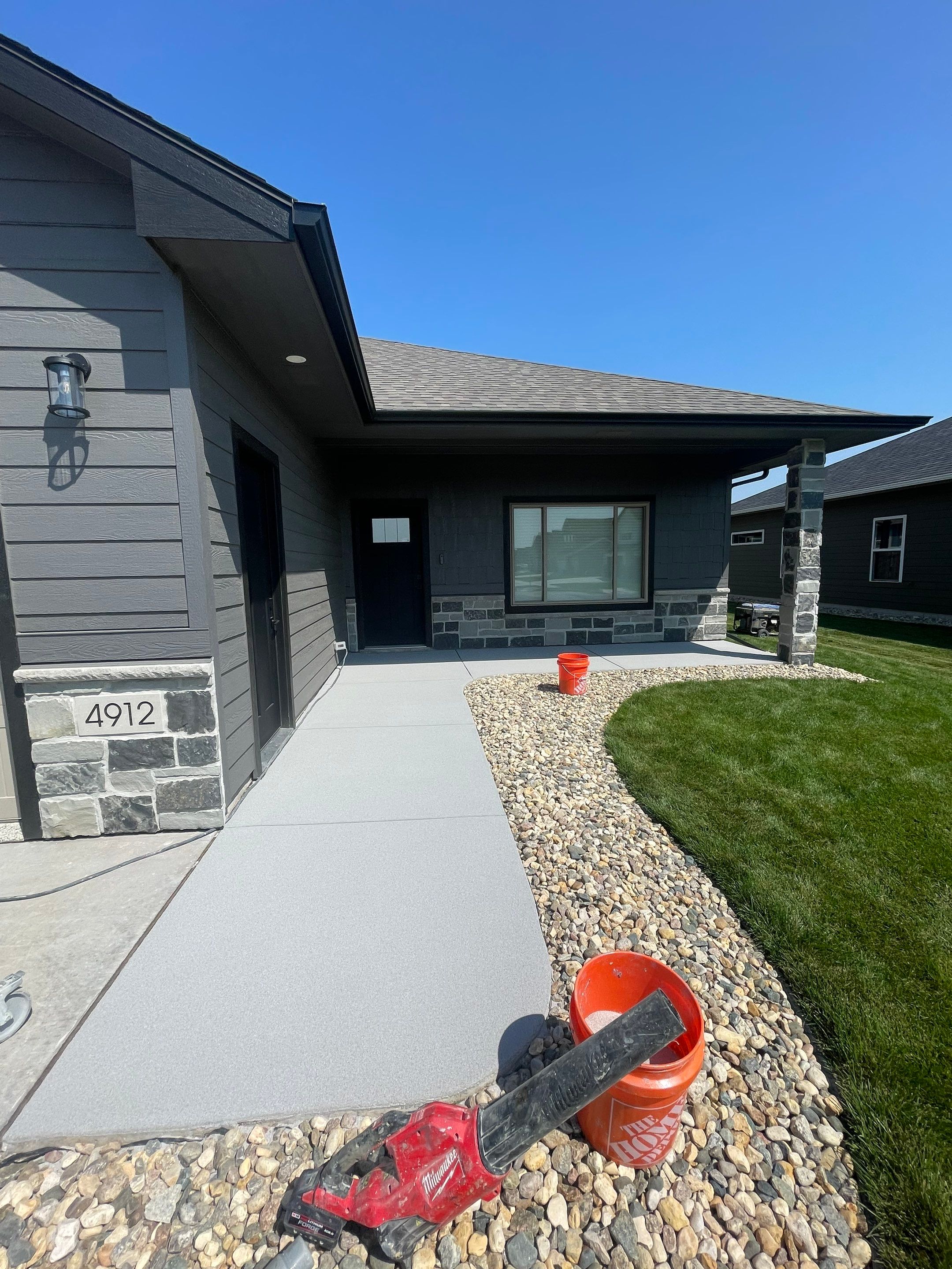 Sioux Falls Residential Concrete Patio and Walkway Coating by Select Painting, Coatings & Garage Cabinets