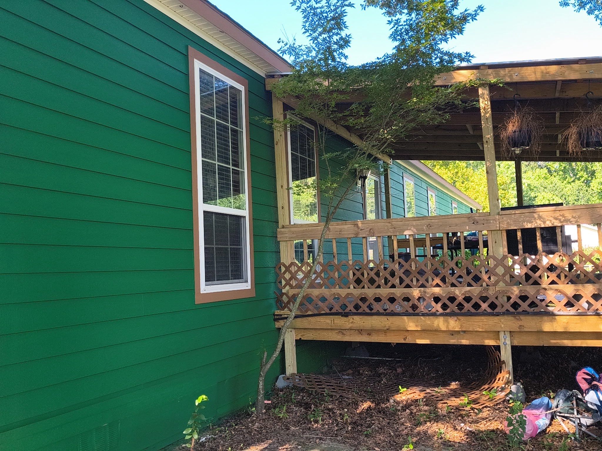 Exterior Painting in Lindale, TX | Bright Green Wood House Repaint by Quality Coats Painting