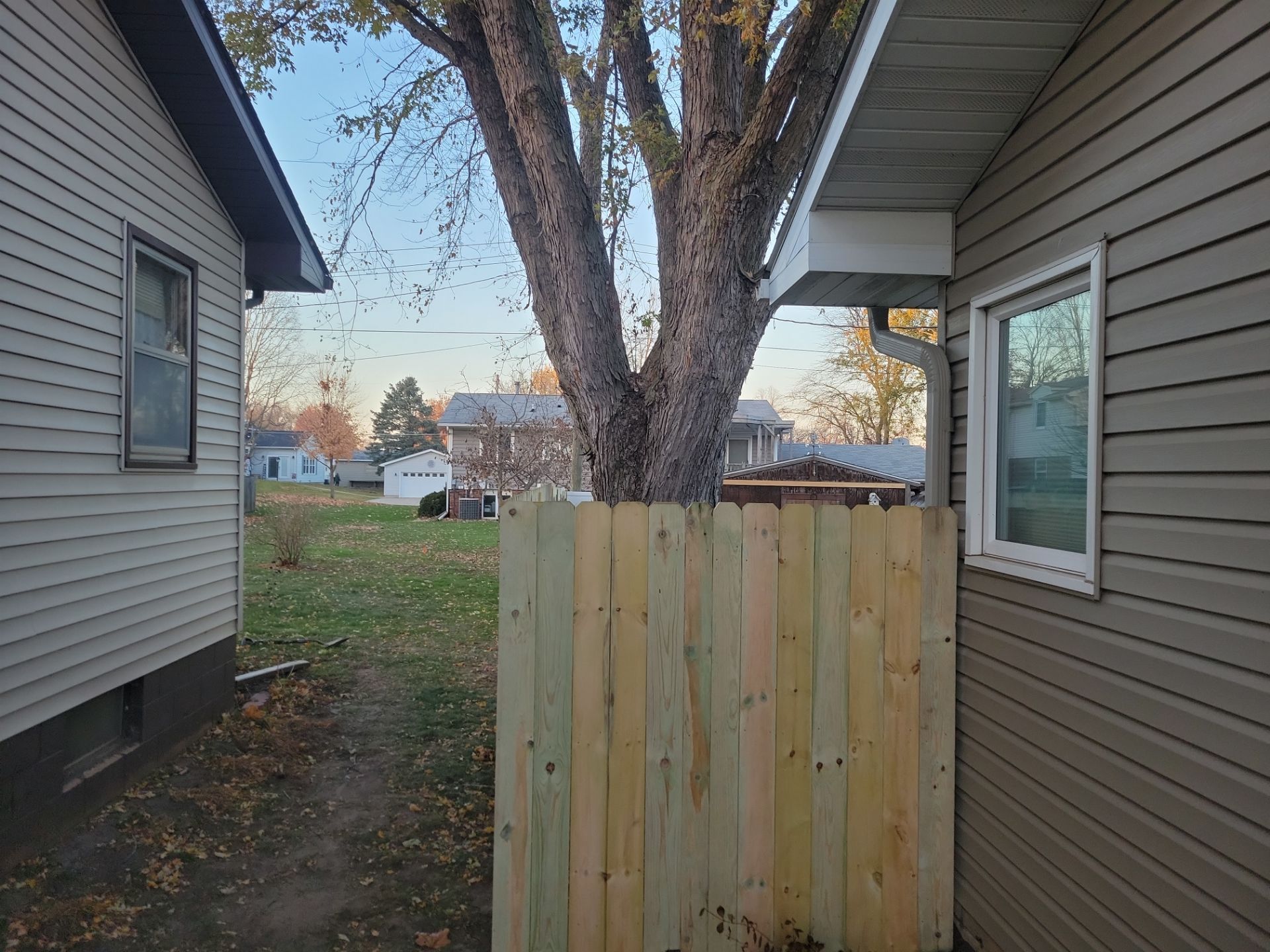 New Pressure-Treated Wood Privacy Fence and Gate in Charles City by Perfect Picket Fence and Stain