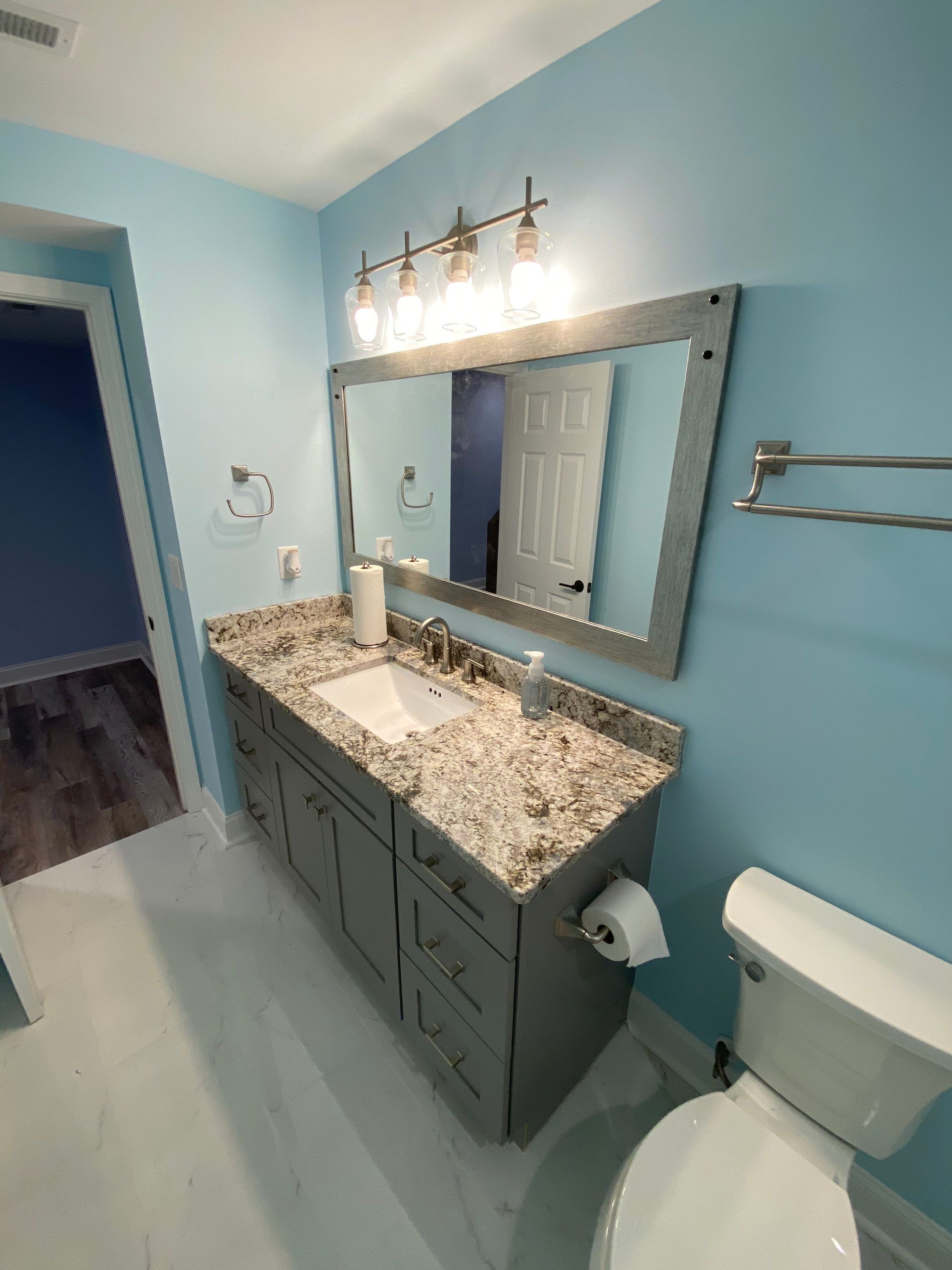 Marietta Basement Remodeling Featuring Custom Wet Bar and Marble Shower by Swift Home Renovations