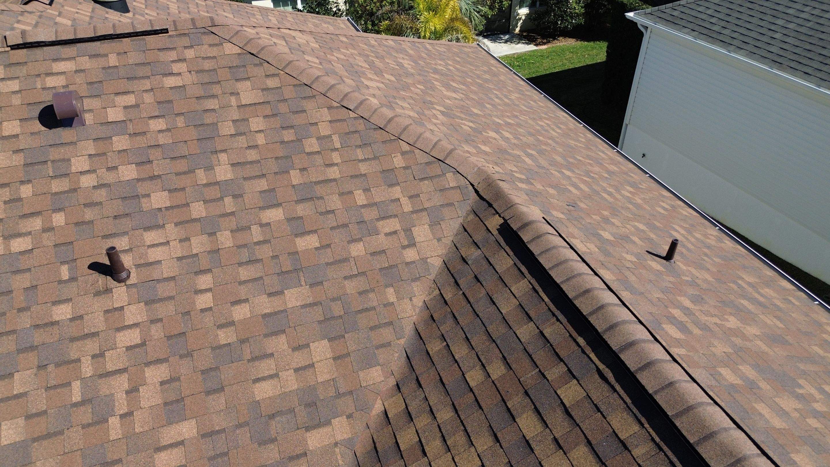 Florida roofers installing shingles by Brehm Roofing