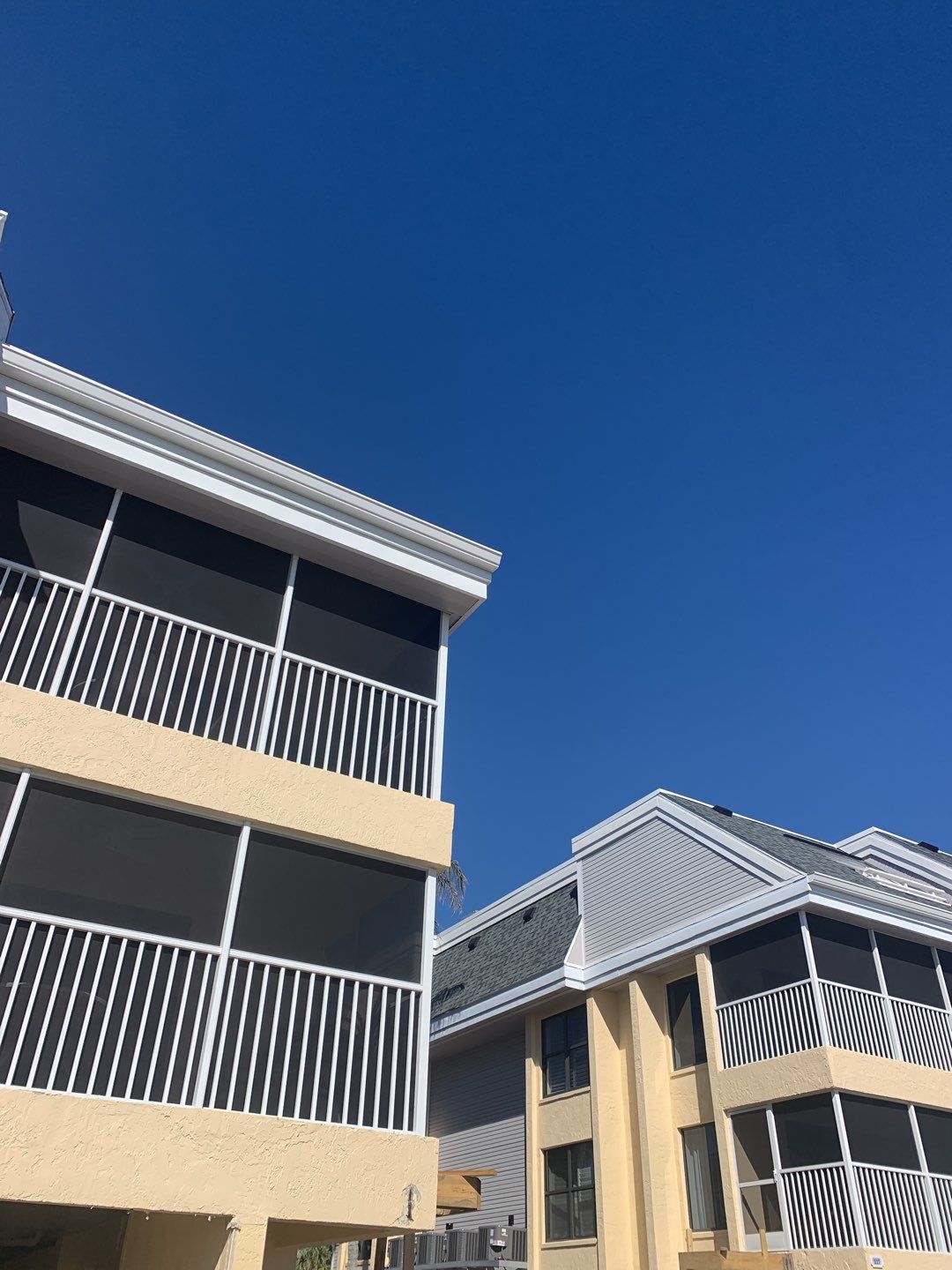 White Seamless Gutters and Downspouts in Sanibel FL by Gutter Professors