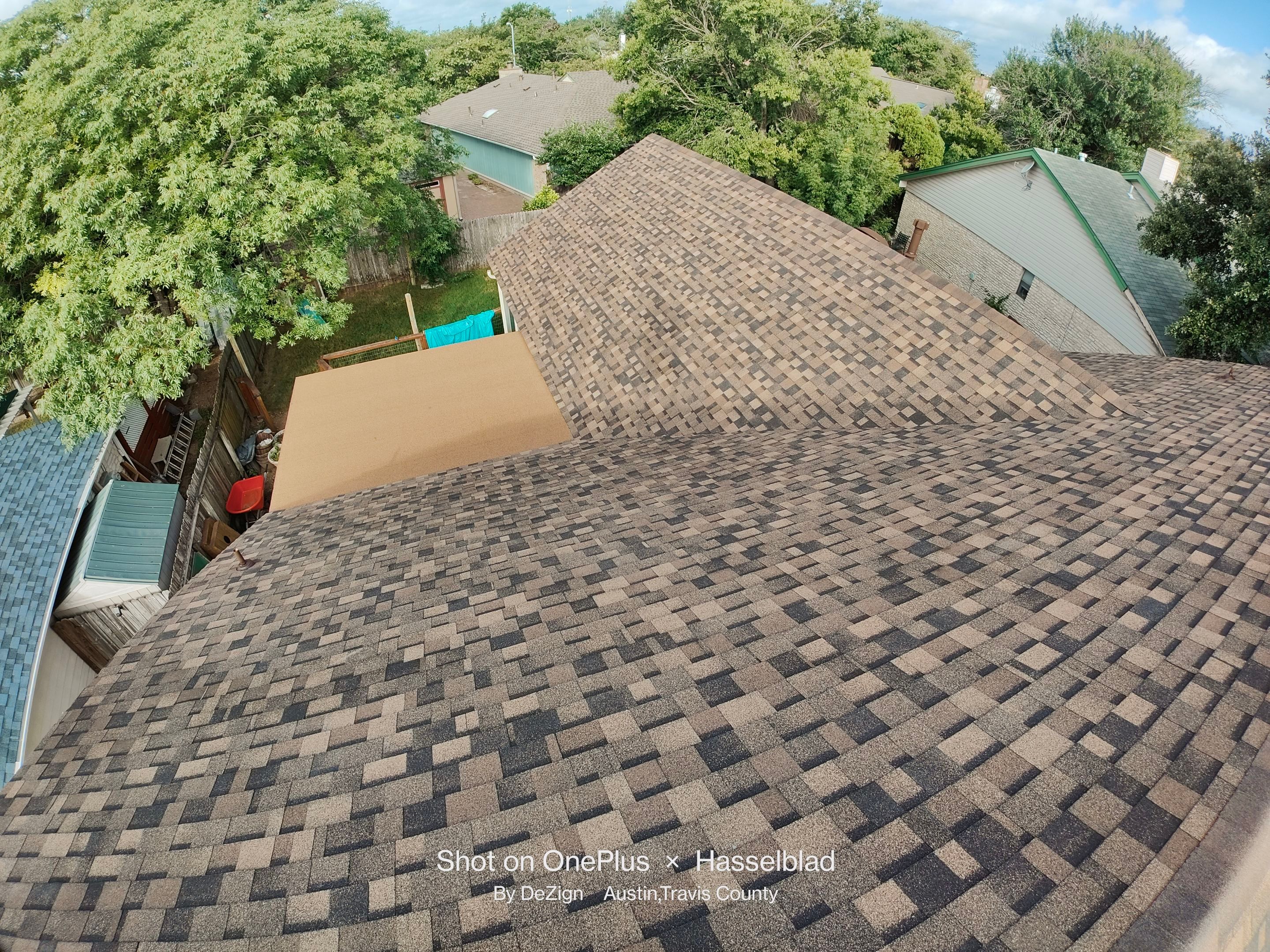 New Roof Installation Of IKO Dynasty Color Brownstone by DeZign Roofing & Exteriors