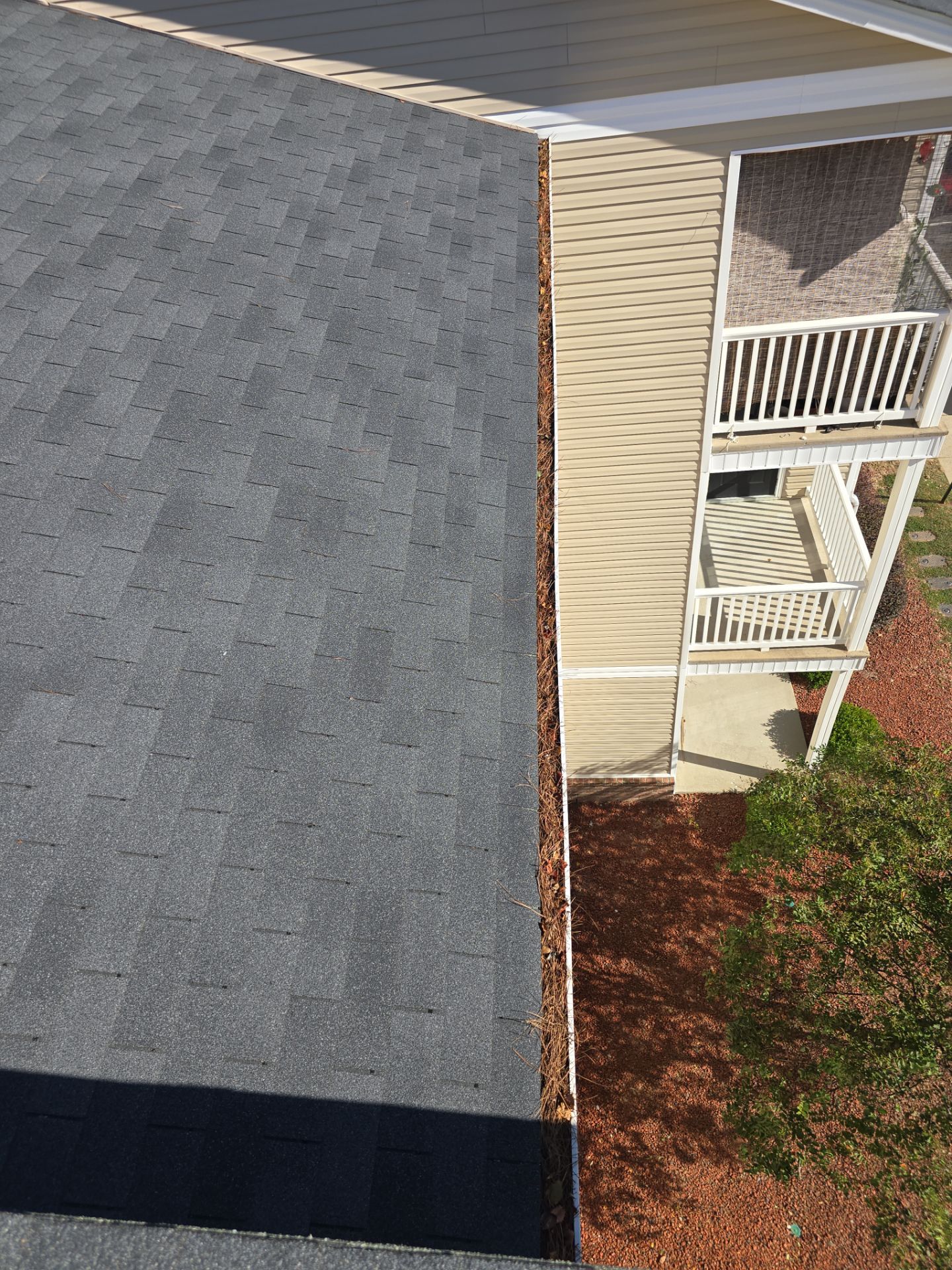 Commercial gutter cleaning Sandhills & Aberdeen, NC before photo with filled gutters