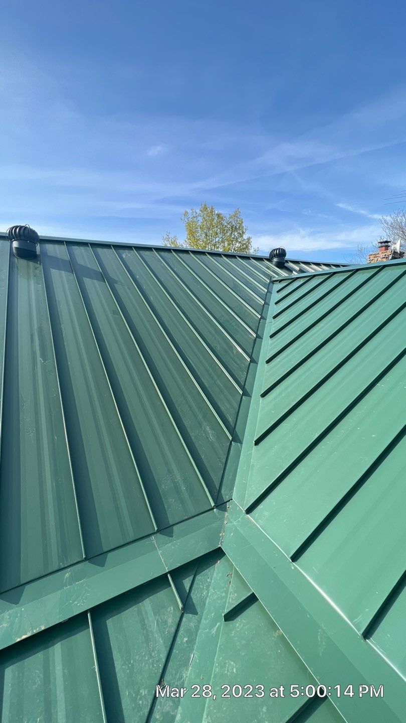 Shingle to Standing Seam Metal Roof by Springtree Restoration