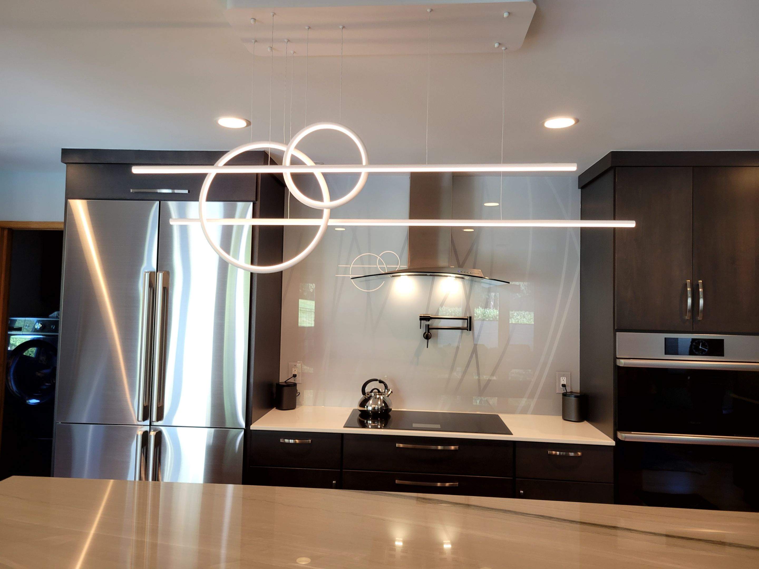 Kitchen Remodel using IMAGIO Misty Curves Solid Glass Backsplash by IMAGIO