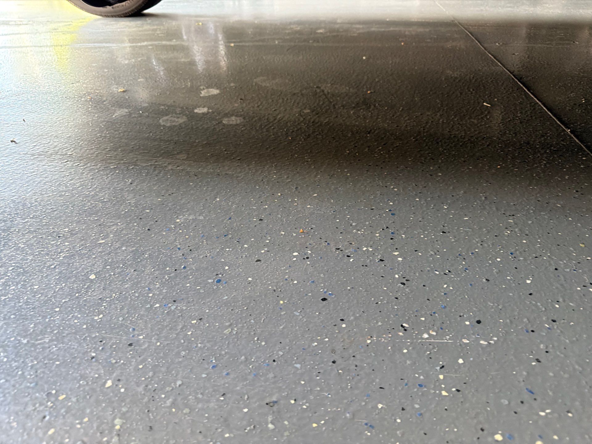 Multi-Car Garage Concrete Coating with Coyote Flake Finish in Sioux Falls by Select Painting, Coatings & Garage Cabinets