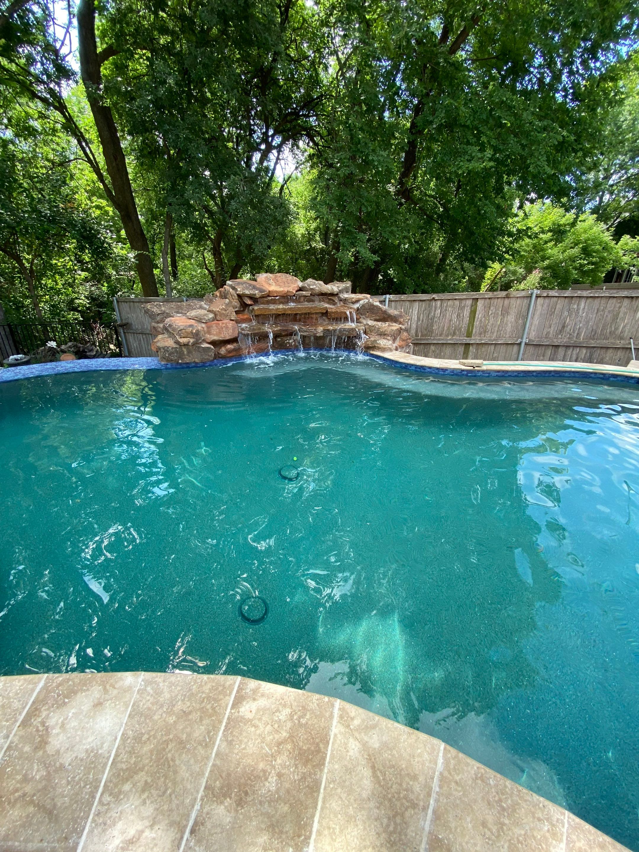 Freeform Pool with Rock Waterfall and Raised Spa by Pinnacle Pools and Spas - DFW