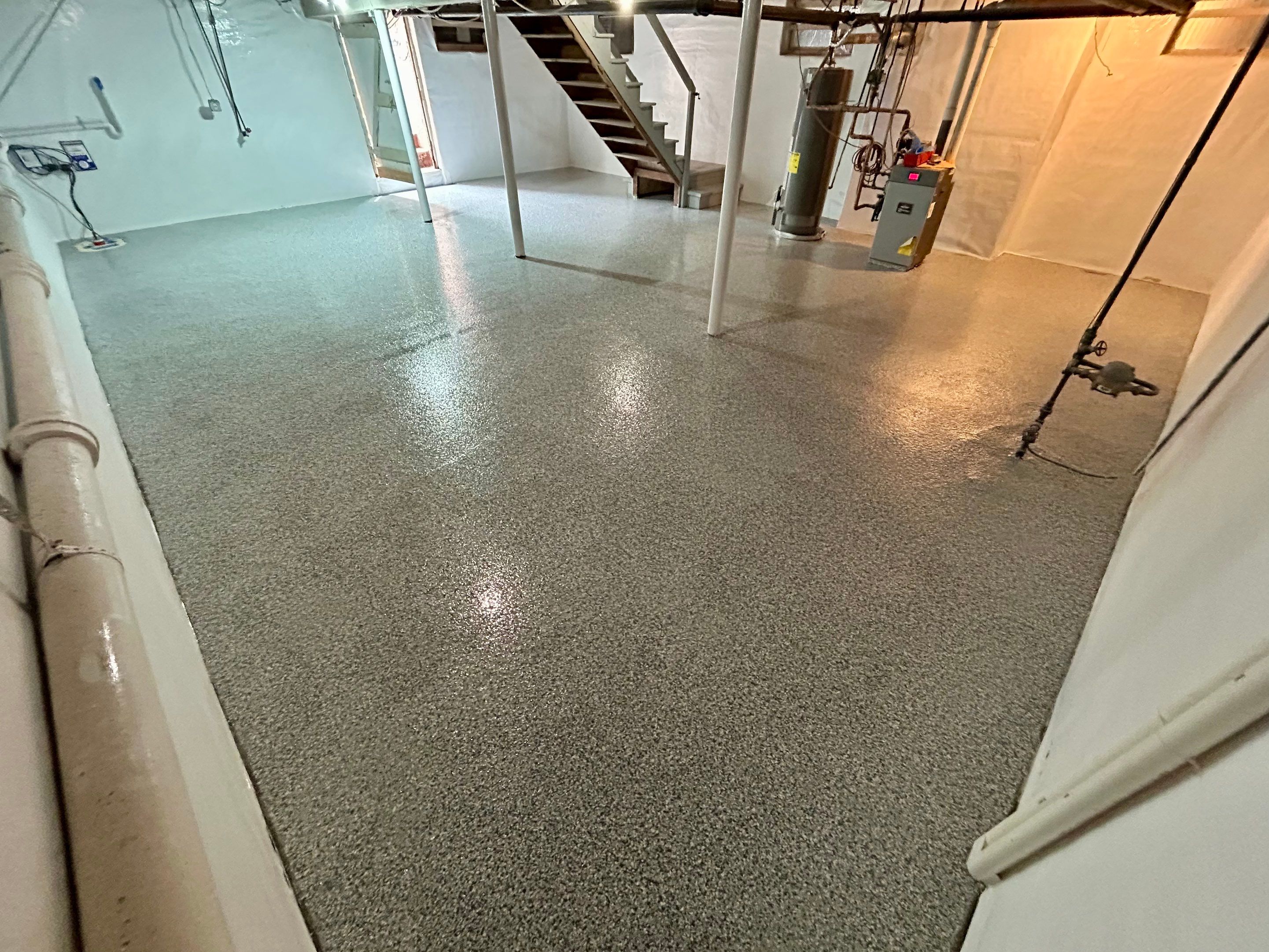 Basement floor Coating Transformation by DiGiorgi Roofing and Siding Inc