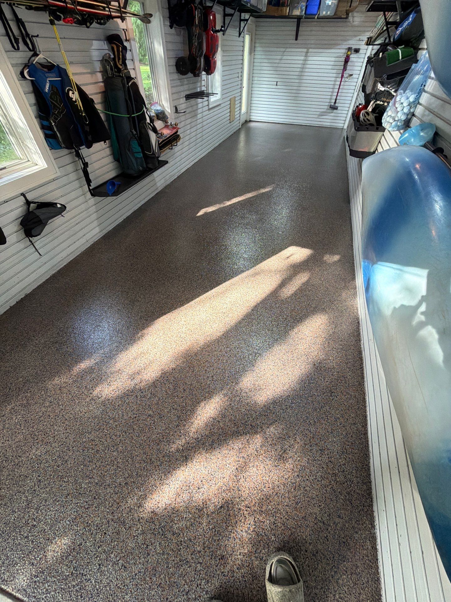 Residential Garage Epoxy Flake Floor Installation in Grand Haven by Gordon Painting