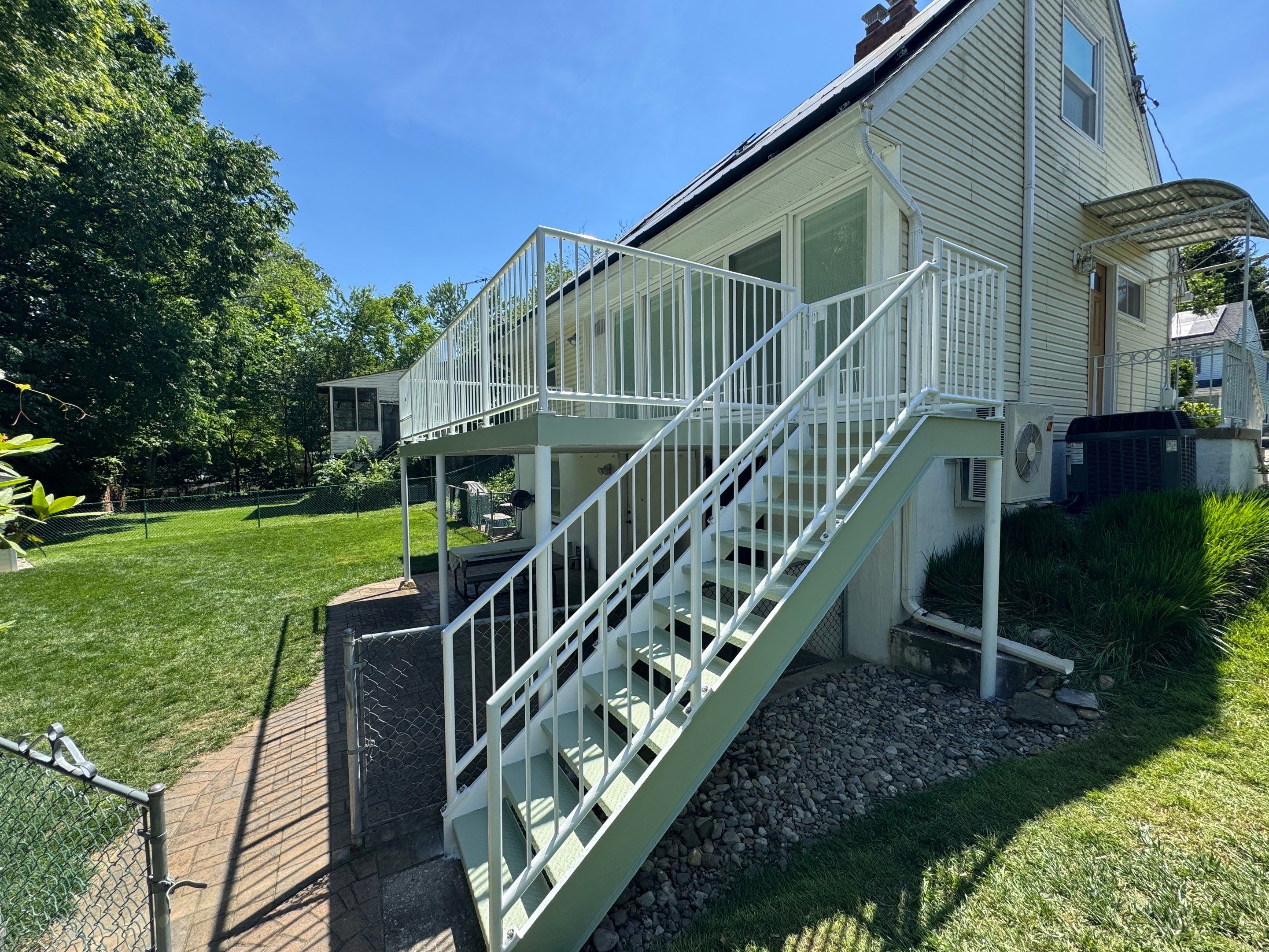 White Powder-Coated Outdoor Railings in Rockville & Staircase and Deck Refurbishment  by Capitol Iron Works