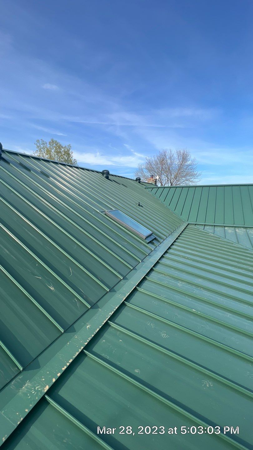 Shingle to Standing Seam Metal Roof by Springtree Restoration 