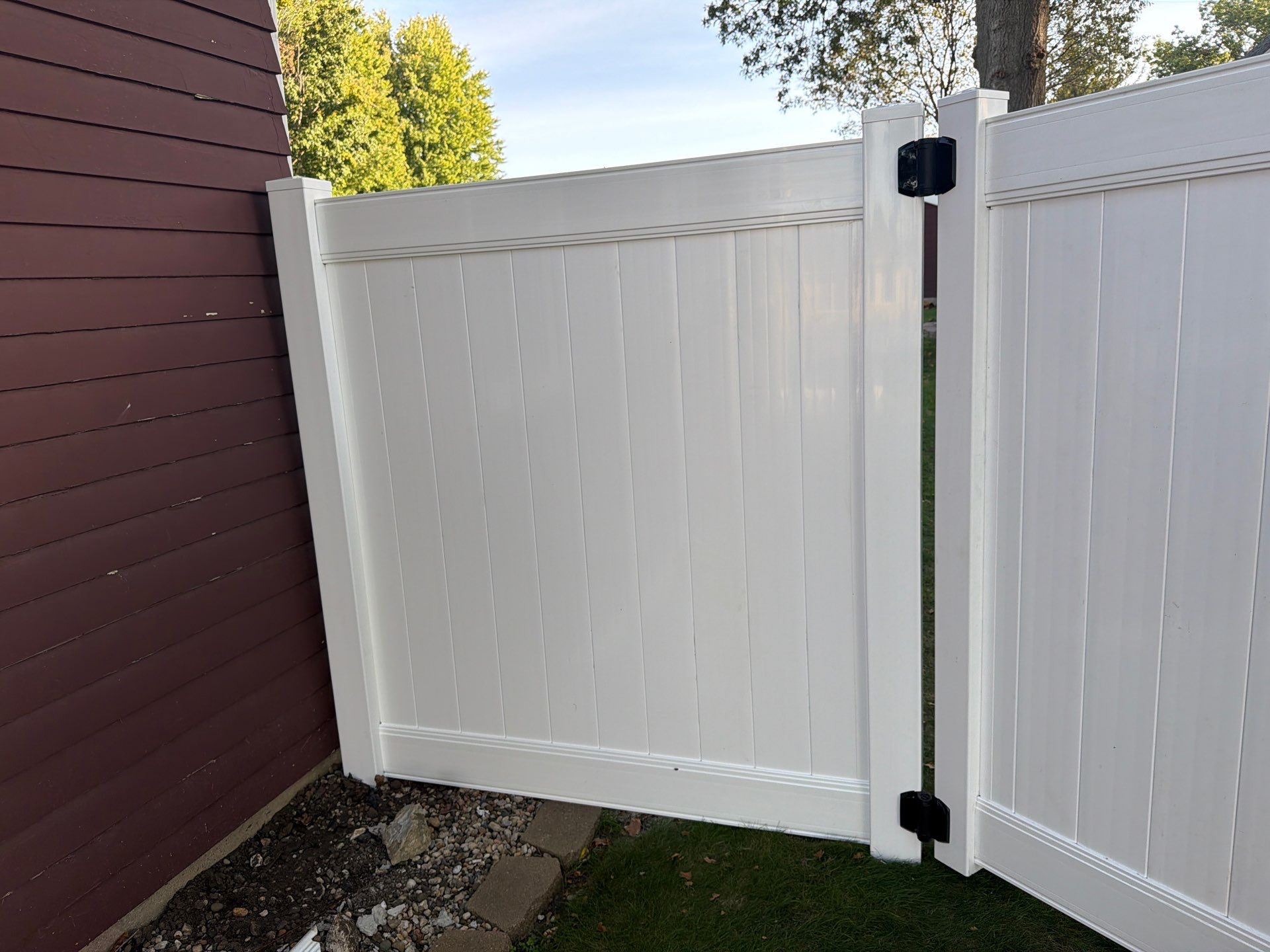 White Vinyl Privacy Fence and Gate Installation in Grundy Center by Perfect Picket Fence and Stain