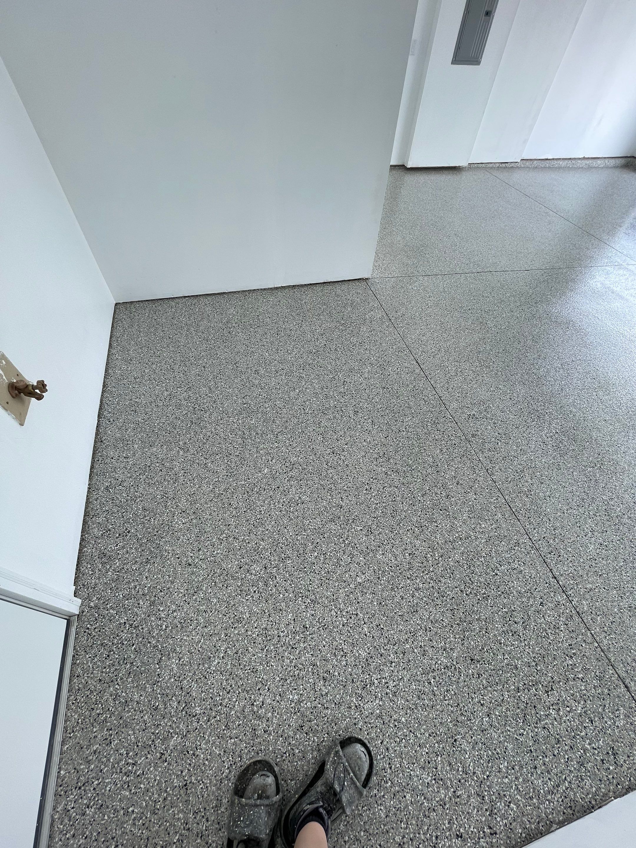 Sioux Falls Garage Floor Transformation with Cabin Fever Decorative Chips by Select Painting, Coatings & Garage Cabinets