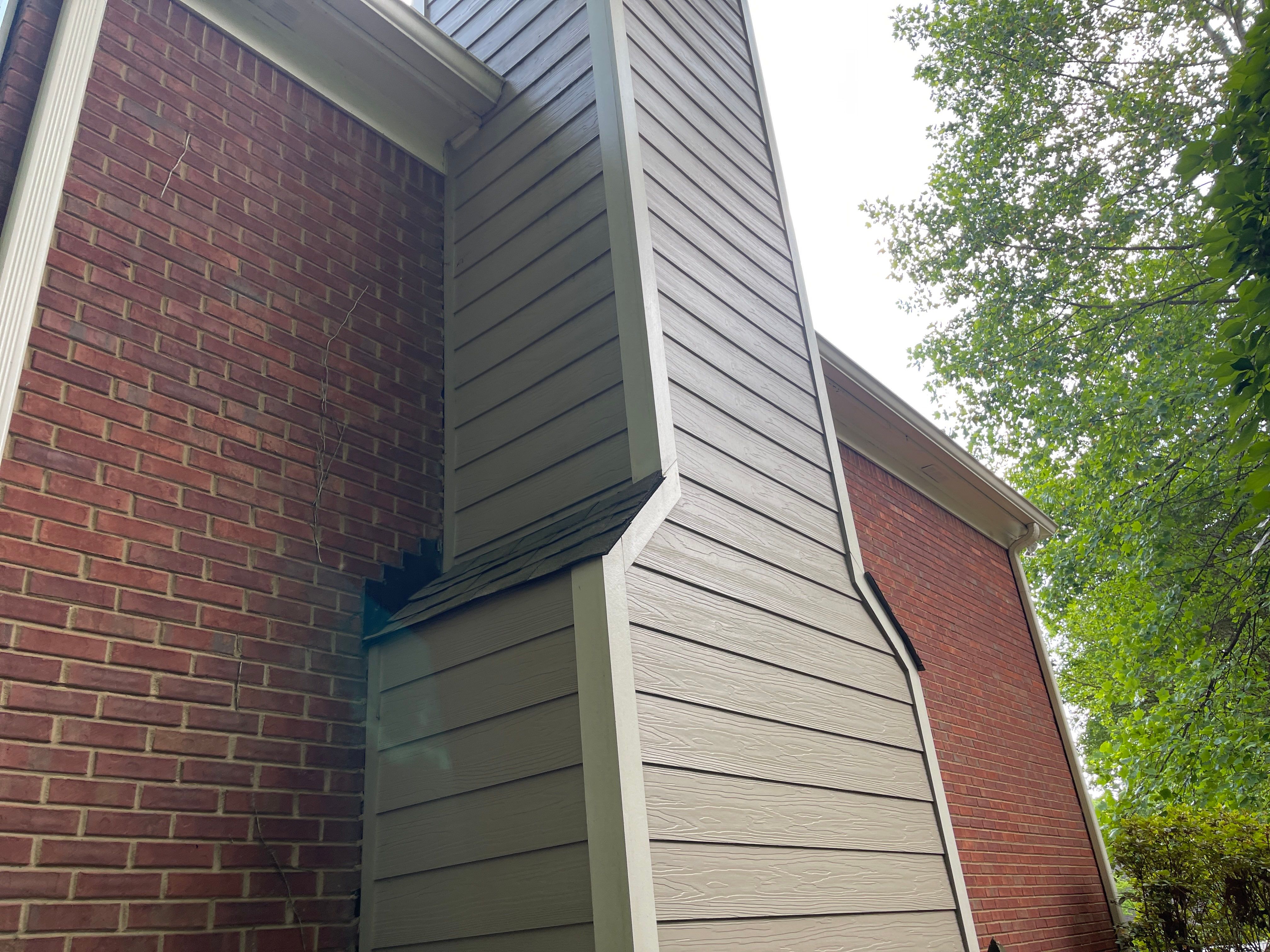 Marietta, GA Rotten Wood Replacement, Chimney Corner Board Installation, Gutter Replacement, and Exterior Painting by Nelson Exteriors