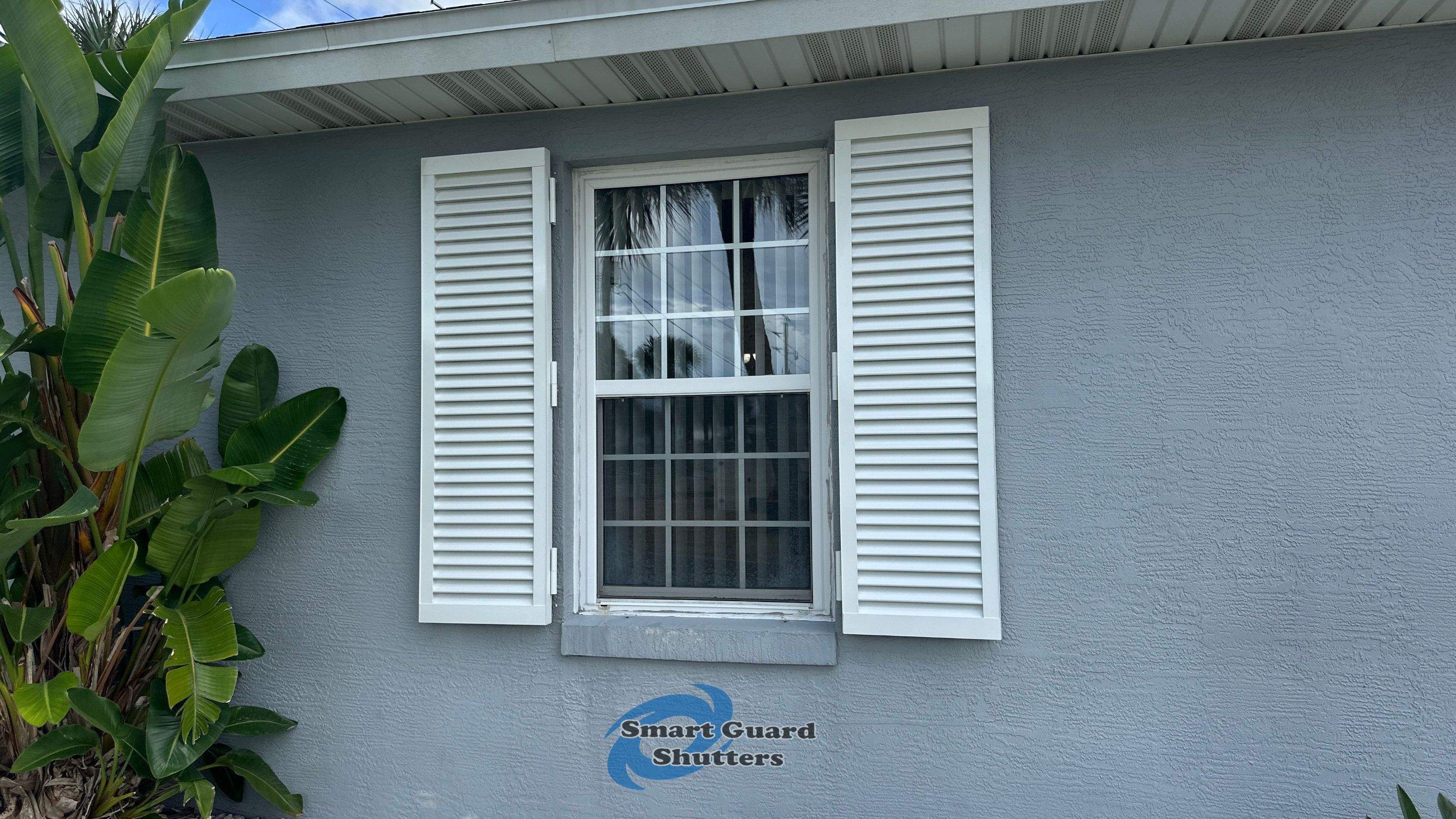 Impact Colonial Shutters in Signal White by Smart Guard Shutters